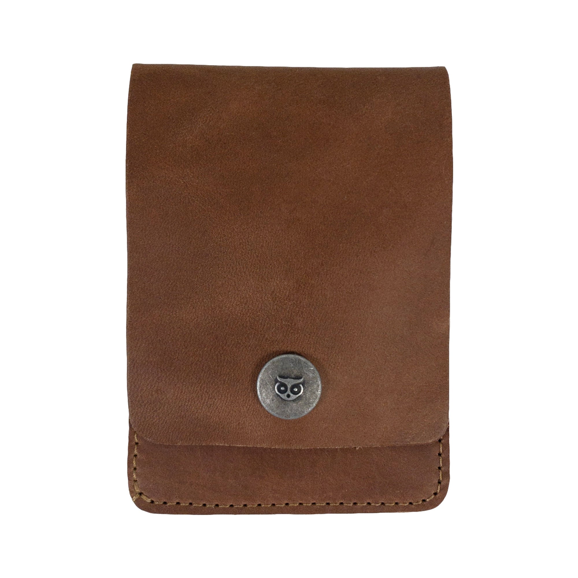 Front view of a brown variant of the Vertical Wallet by Hide & Drink, showcasing a simple snap closure. This Vertical Front Pocket Wallet with Card Slot provides compact storage for bills and cards, made from high-quality full grain leather reflecting small batch production methods, hand cut, hand sewn, and fire branded by craftsmen. Handmade in La Antigua Guatemala & Oaxaca Mexico.