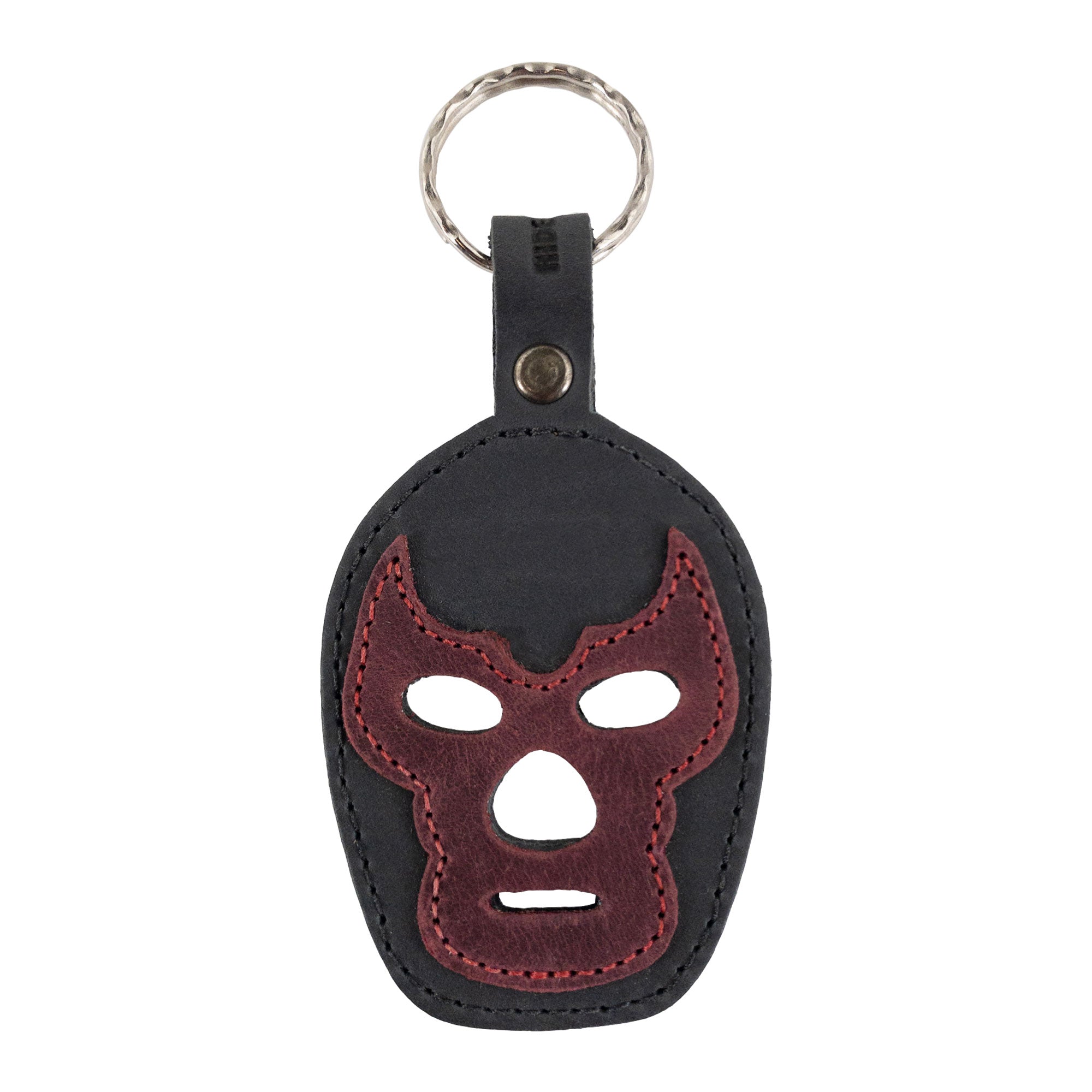 A Luchador Mask Leather Keychain in vibrant colors with unique design elements, perfect for those who love personalized accessories. This keyring from Hide & Drink is a practical key organizer made from high-quality full grain leather, demonstrating the artistry that defines small batch production, hand cut and sewn in La Antigua Guatemala and Oaxaca Mexico.