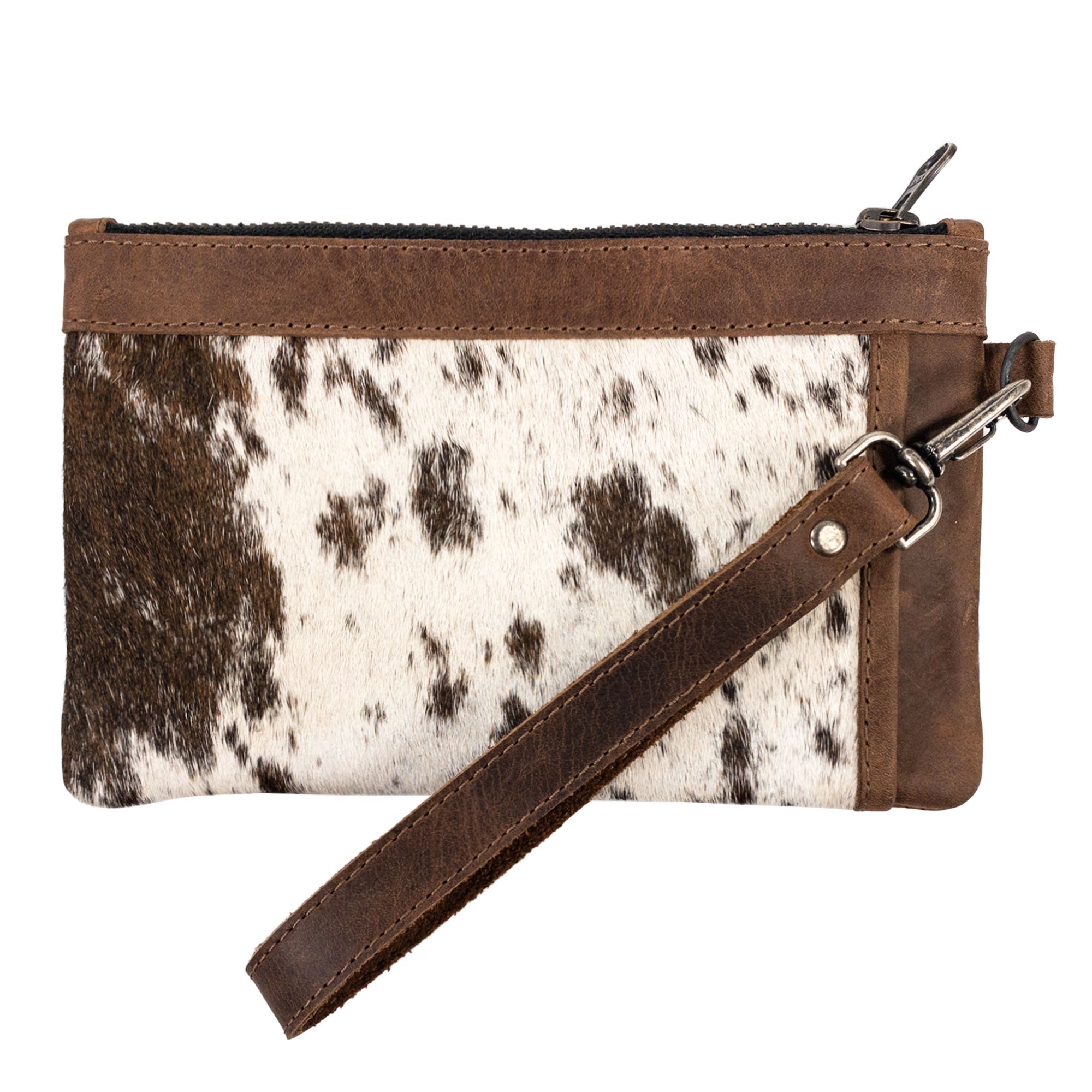 Handmade Wristlet Clutch Bag by Western Leather Works featuring a hair-on-hide design, perfect for evening outings. This rectangular wristlet clutch handbag embodies a Western style made of full grain leather, ensuring durability with small batch production techniques. Artisan-crafted in La Antigua Guatemala.