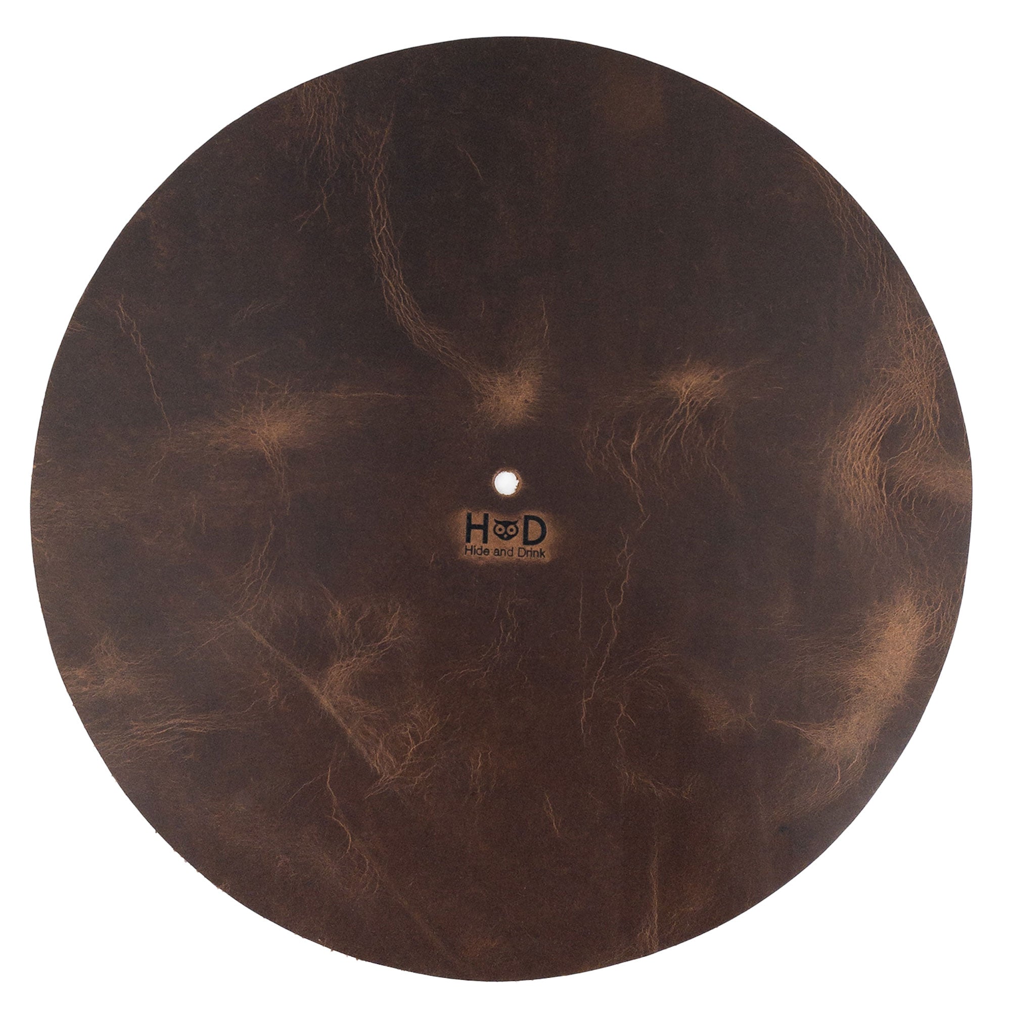 Hide & Drink Turntable Slipmat showcasing a rich, dark full grain leather texture, designed to enhance your vinyl experience while reducing noise and static. This classy turntable slipmat is handcrafted with care, featuring small batch production and artisan techniques from La Antigua Guatemala. Perfect for vinyl lovers seeking a unique, handmade touch with a warranty.