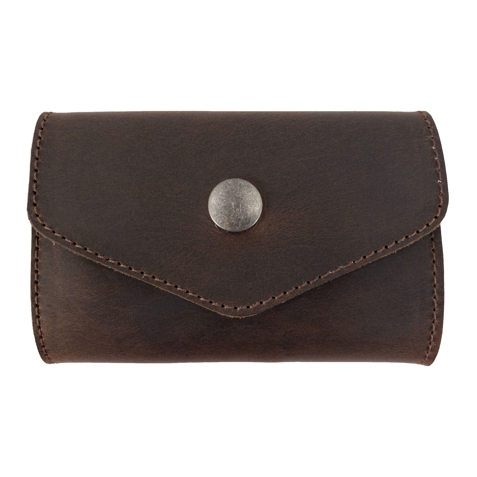 Stylish Nail Clipper Roll Case by The Stockyard Exchange, crafted from high-quality Full Grain Leather. This rustic roll serves as a Nail Clipper Set Case, perfect for organizing toiletries while traveling. Handmade in La Antigua Guatemala, each piece is meticulously hand cut, fire branded, and sewn by artisans, ensuring durability in this small batch production.