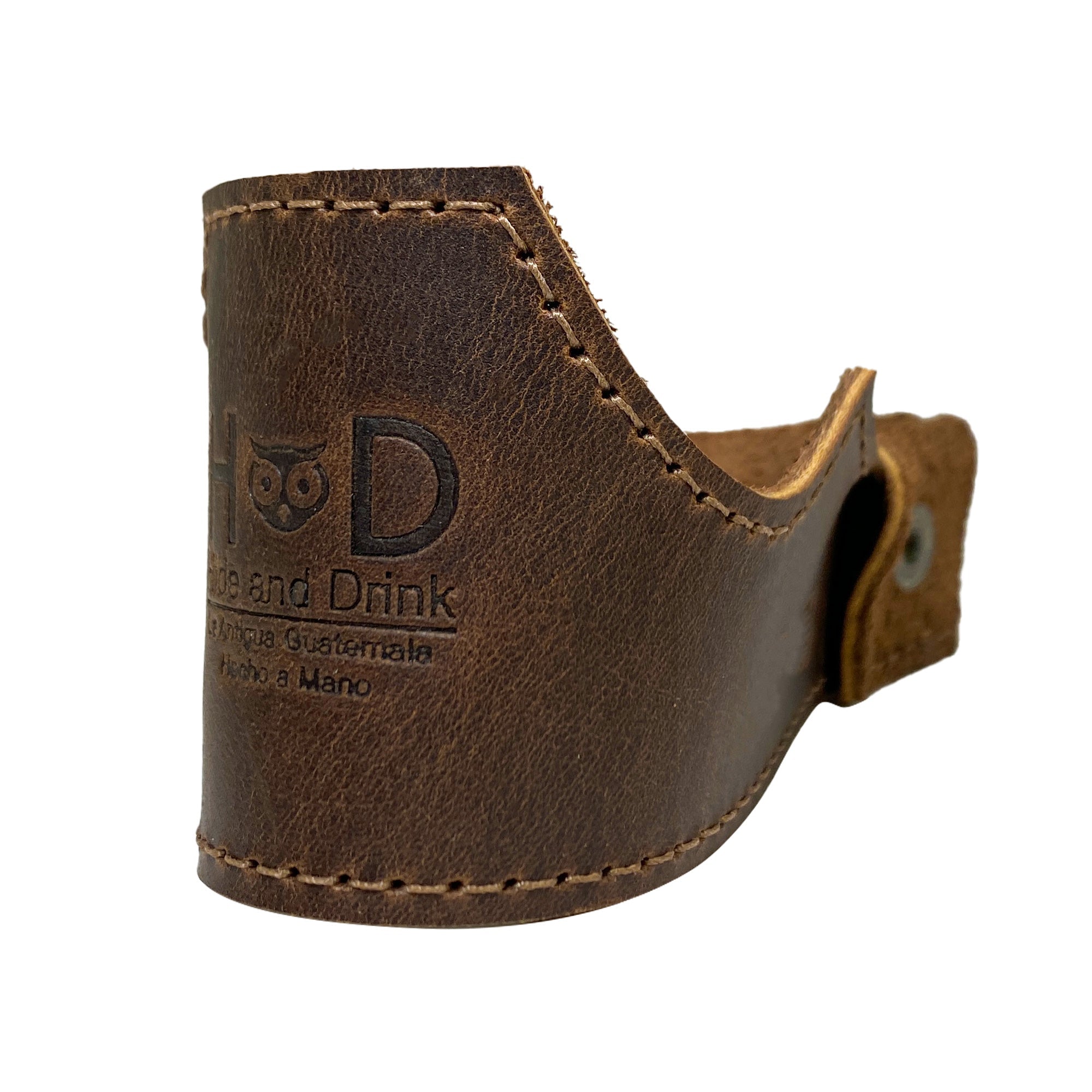 Close-up view of the Tobacco Pipe Holder by Hide & Drink, showcasing its authentic full grain leather craftsmanship. This Tobacco Pipe Holder (Pipe not Included) features a portable & adjustable stand, making it a great smoking accessory for pipe enthusiasts. Made with small batch production techniques, it is hand cut, hand sewn, and fire branded, a true artisan piece handmade in La Antigua Guatemala & Oaxaca Mexico.