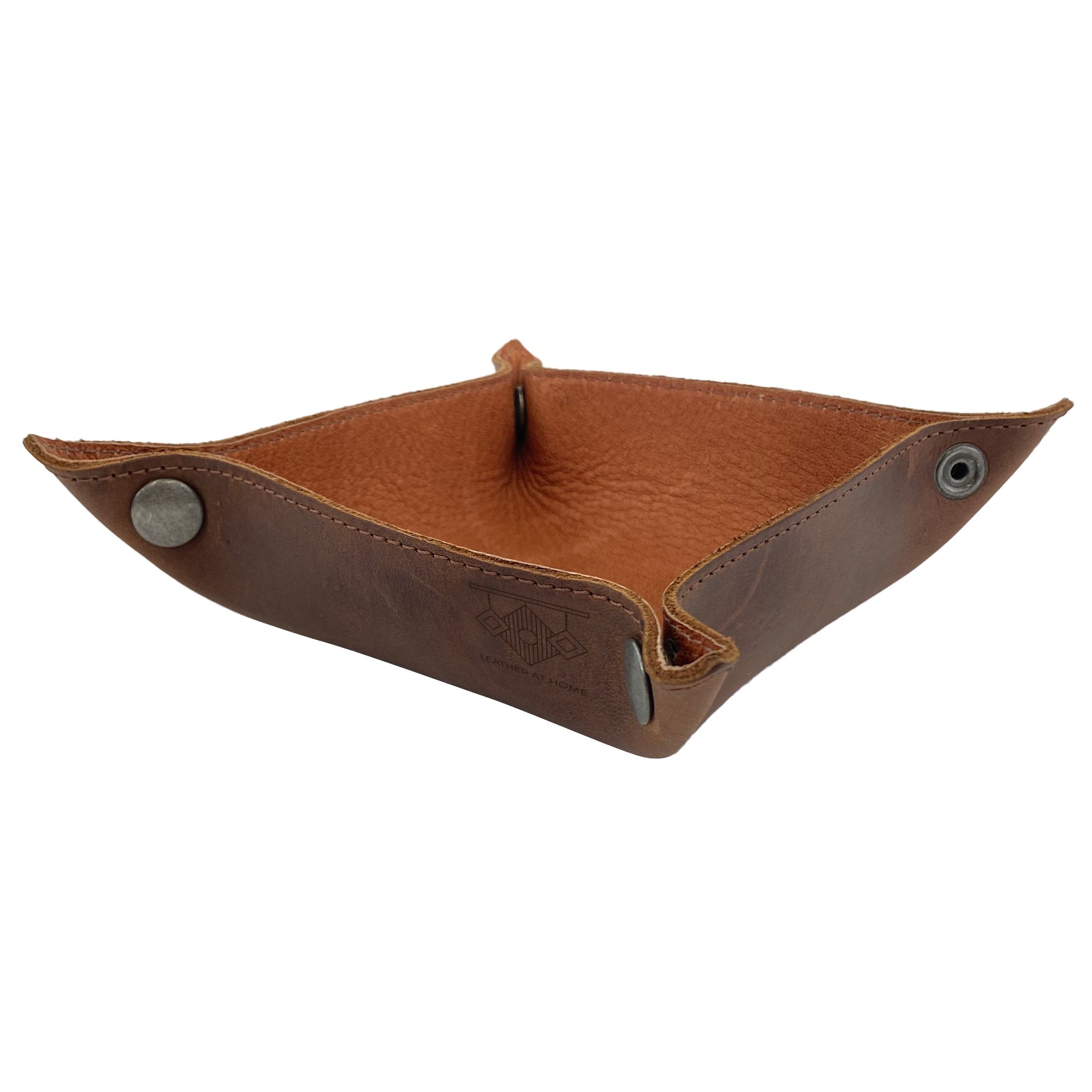 Squared Catchall by Leather At Home featuring a stylish design in full grain leather with brass metal snaps, perfect for organizing change, keys, and other personal items. Ideal as a tray for home and travel essentials, reflecting small batch production and artisan craftsmanship from La Antigua Guatemala.