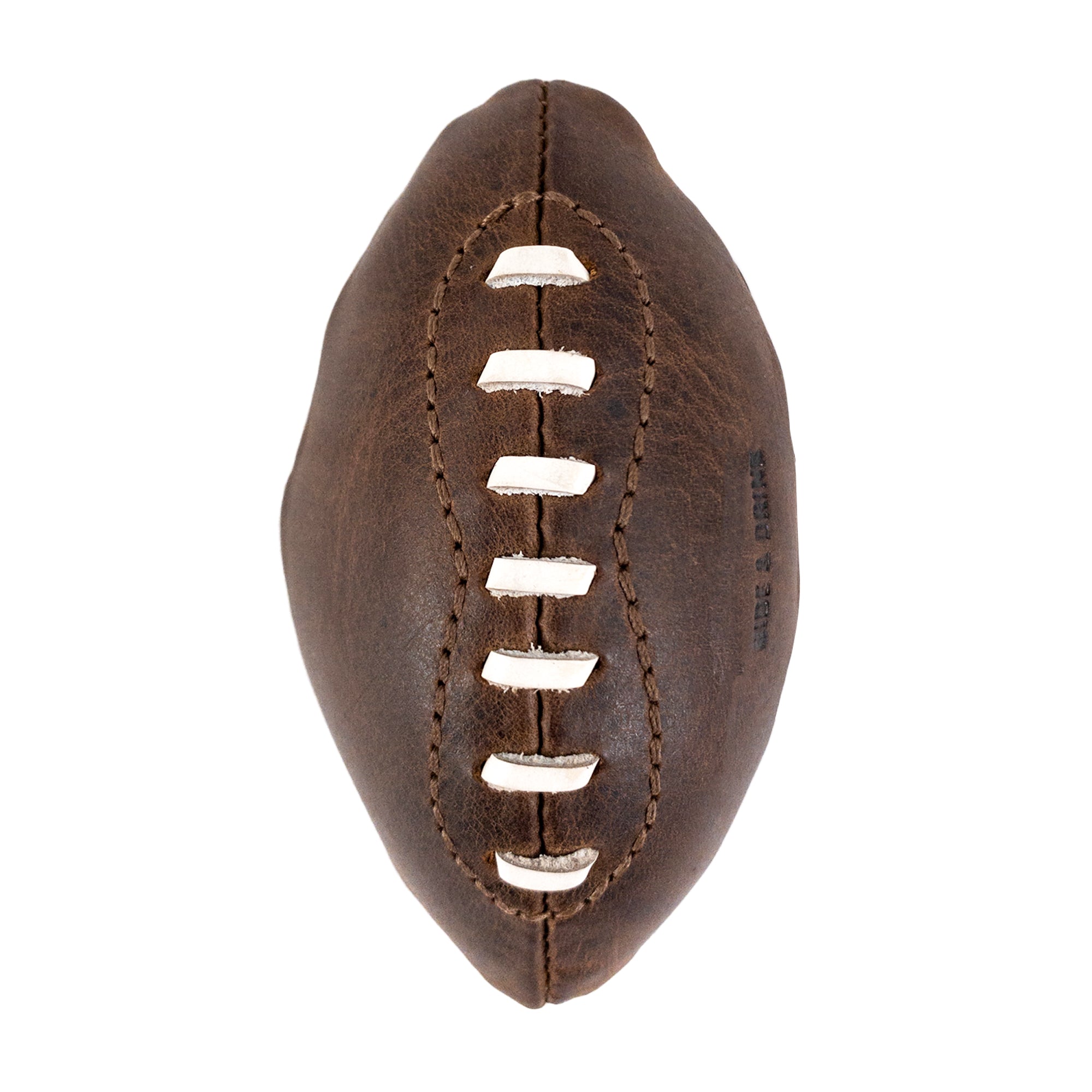 Top view of a Mini American Football by Hide & Drink, crafted from full grain leather with hand-stitched seams. This soft, durable ball serves as a decoration or keepsake, showcasing artisan craftsmanship from Small Batch Production, made in La Antigua Guatemala & Oaxaca Mexico.