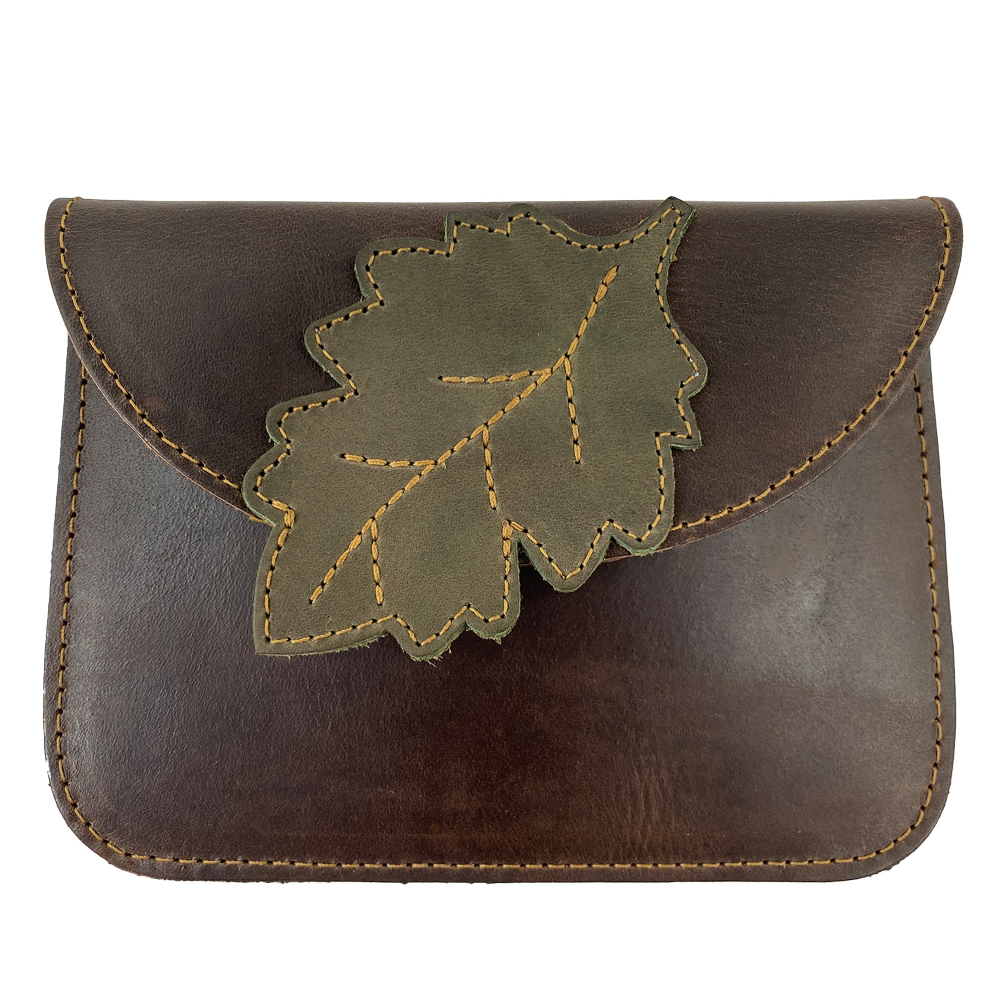 Heather's Leaf Card Wallet featuring a unique leaf design on a brown full grain leather exterior. This versatile Leaf Card Wallet Pouch is perfect as a soft coin & cash organizer, cable holder, or phone & accessories case. Handmade in La Antigua Guatemala, it showcases artisan craftsmanship through small batch production, hand cut, hand sewn, and fire branded techniques.