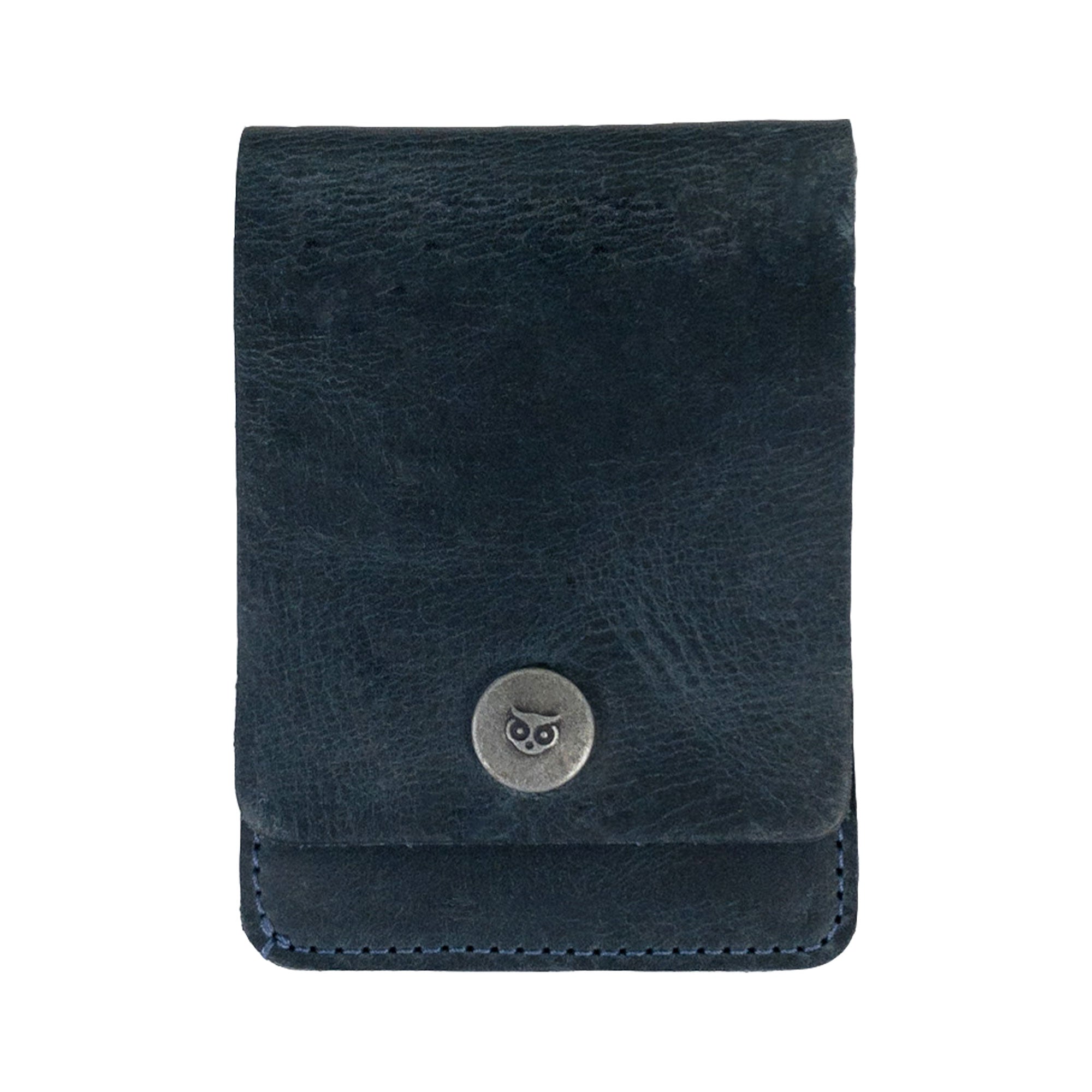 Front view of a blue variant of the Vertical Wallet by Hide & Drink, featuring a metal snap closure. This Vertical Front Pocket Wallet with Card Slot provides compact storage for bills, ensuring card holder functionality as well, made from robust full grain leather through small batch production techniques, hand cut, and hand sewn, fire branded. Handmade in La Antigua Guatemala & Oaxaca Mexico.