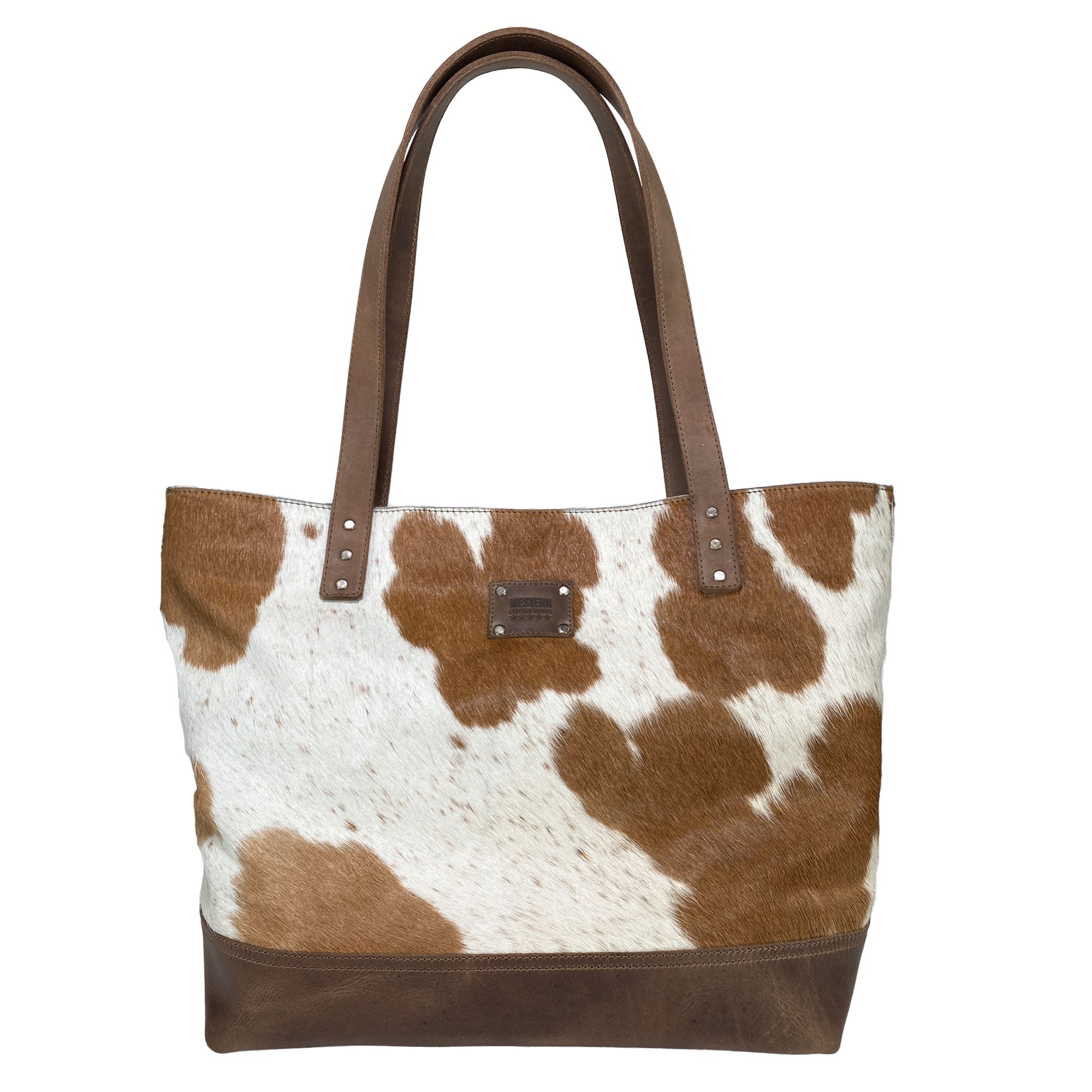 Western Leather Works Formal Tote Bag made from Hair on Hide Full Grain Leather, features a brown striped pattern for a stylish cowboy look. This spacious, versatile tote is ideal for everyday use, showcasing craftsmanship with its hand cut, hand sewn details. The interior is lined with plaid cotton for added charm. Artisan, handmade in La Antigua Guatemala & Oaxaca Mexico.