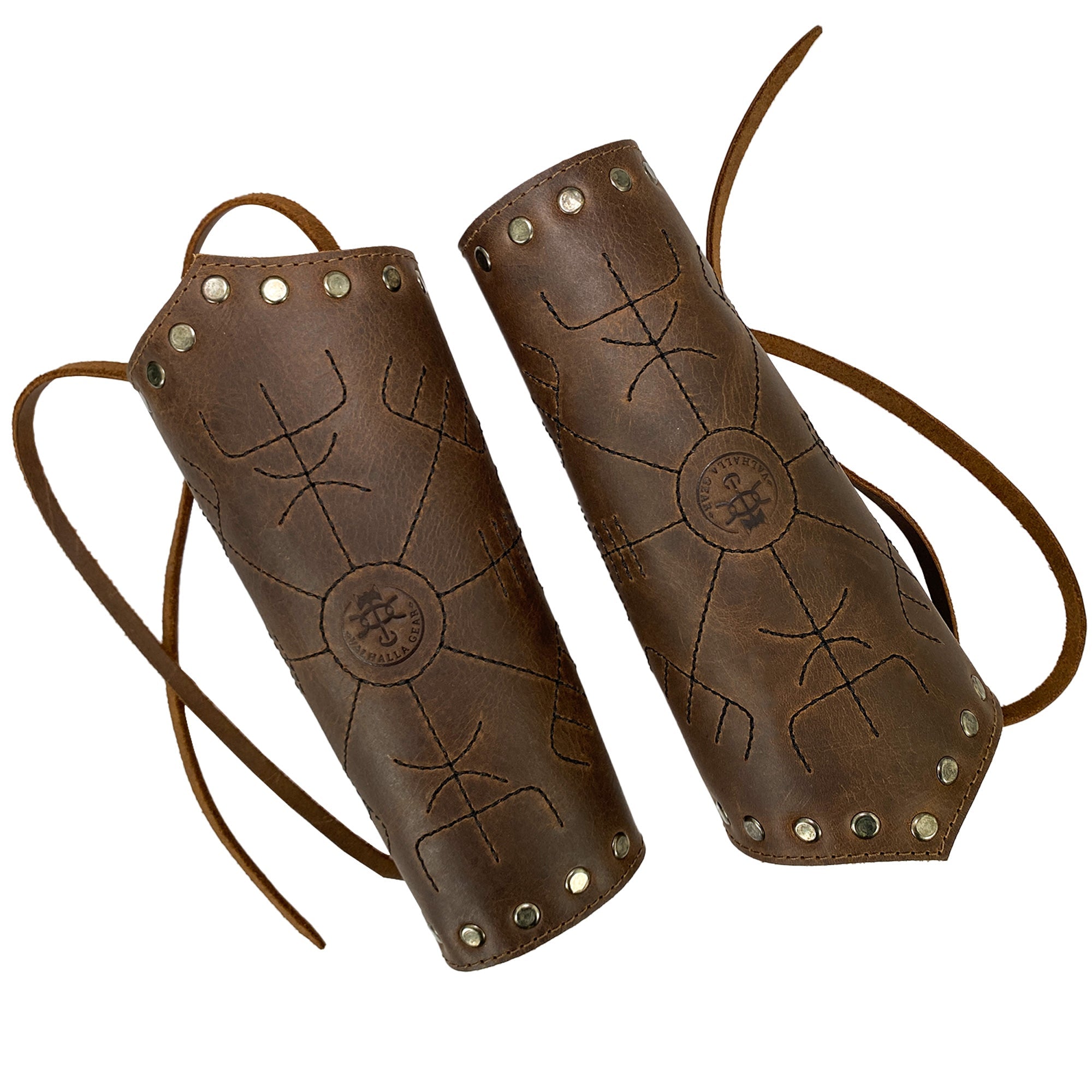 Two Viking Bracers from Valhalla Gear, crafted from full grain leather, showcasing Viking style hand protector designs perfect for archery. These Viking Bracer (2 pack) wrist guards are durable with adjustable straps, hand cut and hand sewn in La Antigua Guatemala, making them an artisan gift. Ideal as a medieval armband, they are fire branded and embody small batch production.