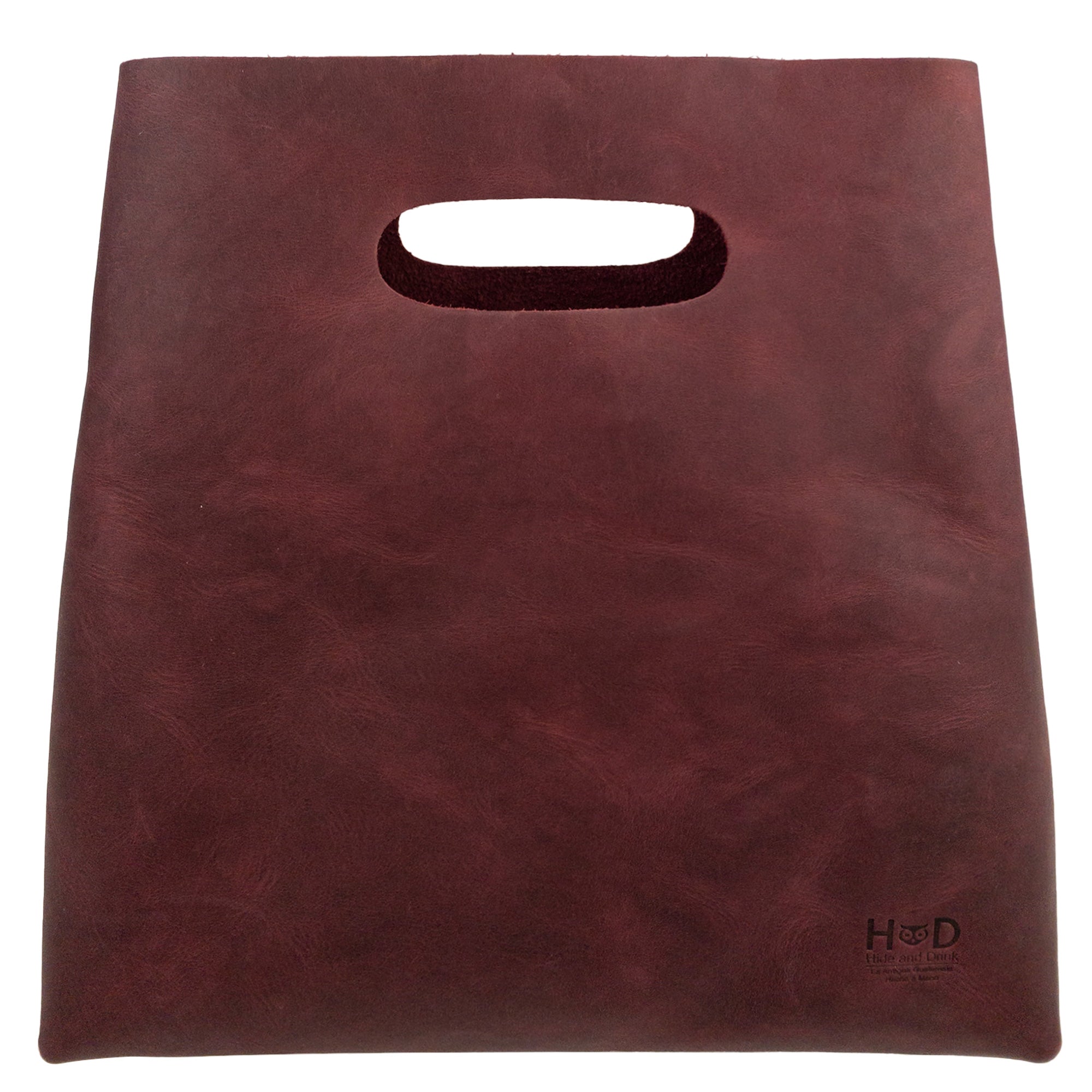 The back view of a red-colored Minimalist Boho Handbag by Hide & Drink, illustrating its elegant construction. This Minimalist Handbag for Women serves as a fashionable Tote Bag, made of rustic Full Grain Leather, reflecting StockyardX's dedication to artisan craftsmanship, produced via Small Batch Production methods in La Antigua Guatemala & Oaxaca Mexico.