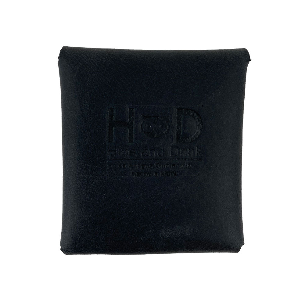 Back view of a navy Minimalist Square Coin Pouch by Hide & Drink, featuring the brand logo. This pouch, made from fine full grain leather, combines simplicity with artisan quality, making it a beautiful add-on for any outfit. Minimalist Coin Pouch, SD Card Holder, Wallet and Cash Organizer, Full Grain Leather, StockyardX, Small Batch Production, Hand Cut, Hand Sewn, Fire Branded, Artisan, Handmade in La Antigua Guatemala & Oaxaca Mexico.