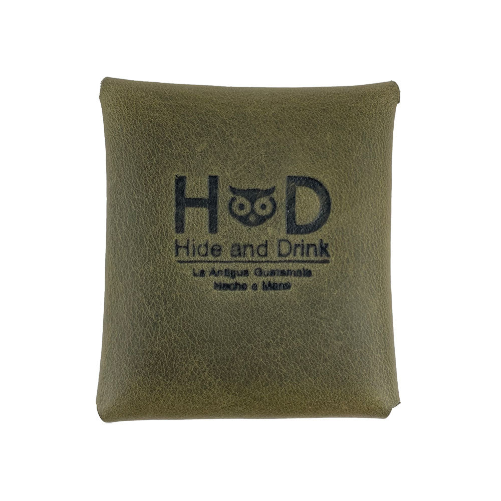 Back view of an olive green Minimalist Square Coin Pouch by Hide & Drink with the embossed logo visible. Highlighting durable full grain leather, this pouch combines artisan craft with practicality, making it an essential accessory. Minimalist Coin Pouch, SD Card Holder, Wallet and Cash Organizer, Full Grain Leather, StockyardX, Small Batch Production, Hand Cut, Hand Sewn, Fire Branded, Artisan, Handmade in La Antigua Guatemala & Oaxaca Mexico.