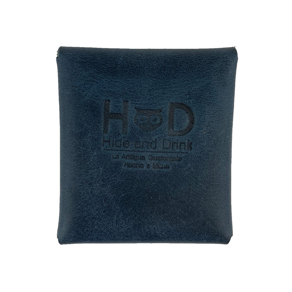 Back view of a tan Minimalist Square Coin Pouch by Hide & Drink with the embossed logo visible. This elegantly crafted leather pouch highlights artisanal craftsmanship and practical style, making it a must-have accessory. Minimalist Coin Pouch, SD Card Holder, Wallet and Cash Organizer, Full Grain Leather, StockyardX, Small Batch Production, Hand Cut, Hand Sewn, Fire Branded, Artisan, Handmade in La Antigua Guatemala & Oaxaca Mexico.