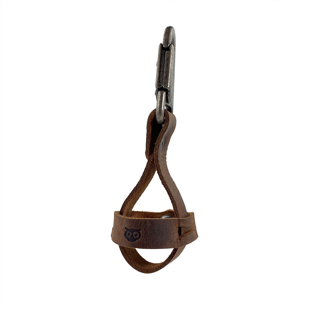 Elegant Golf Ball Holder from Hide & Drink showcasing a unique design with a belt loop hook, crafted from rustic full grain leather. This handmade piece is part of small batch production, expertly cut, sewn, and fire branded in La Antigua Guatemala & Oaxaca Mexico.