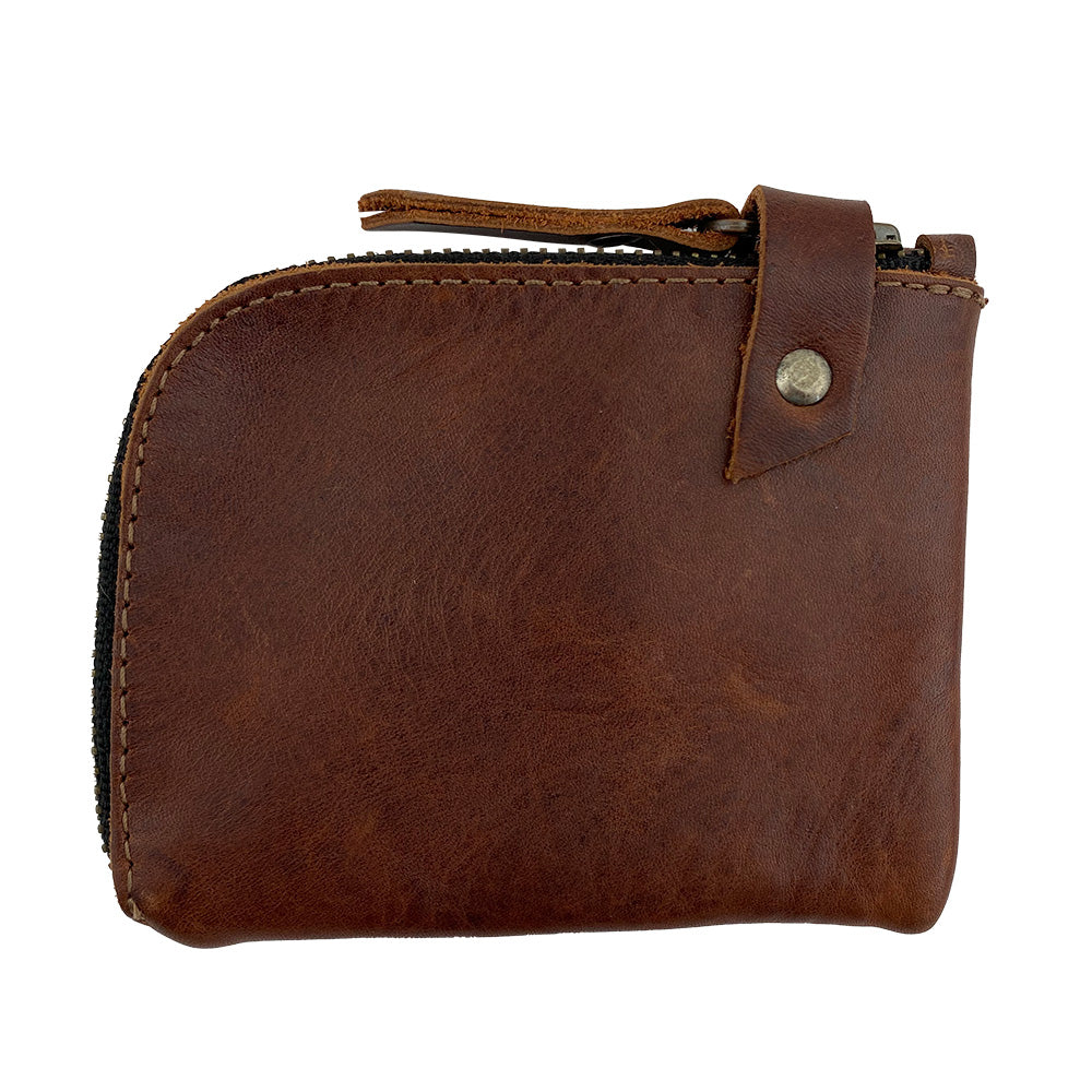 Lion's Mane Zippered Wallet by Hide & Drink, showcasing a compact design crafted from durable full grain leather. This pocket-size wallet is perfect for storing cards, folded bills, and change, making it the ultimate cash holder for everyday use.