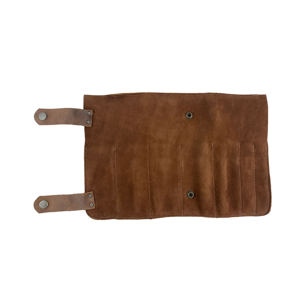 Close-up view of Hide & Drink's Barber Tool Roll, this Snap Tool Roll Up Bag with 14 Slots is perfect for storing scissors & screwdrivers. Made from Full Grain Leather, this portable carry case embodies StockyardX's small batch production ethos and artisan craftsmanship, hand cut, hand sewn, and fire branded in La Antigua Guatemala & Oaxaca Mexico.