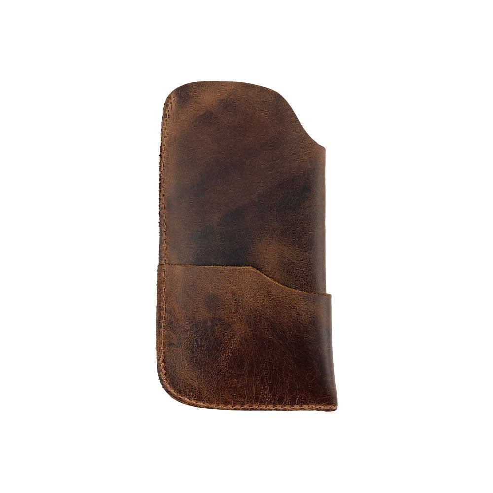 The Hide & Drink Sunglass Case & Wallet displayed elegantly, highlighting its Full Grain Leather craftsmanship. This Rustic Sunglasses Case & Wallet is perfect for those needing a stylish eyeglasses sleeve for travel, featuring artisan touches from La Antigua Guatemala & Oaxaca Mexico.