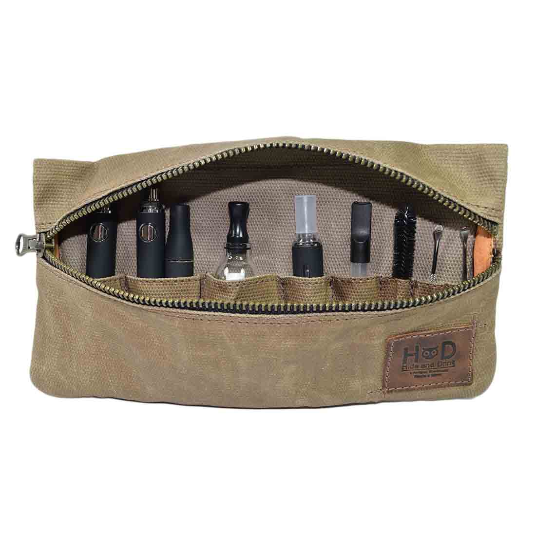 Handmade from waxed canvas, this Hide & Drink Vape Pen Case (Accessories not included) features multiple pockets for pen accessories and is perfect for secure fit travel. Pen Accessories Kit Pouch Holder, Secure Fit, G Pen Soft Travel Bag Handmade from Waxed Canvas, Full Grain Leather, StockyardX, Small Batch Production, Hand Cut, Hand Sewn, Fire Branded, Artisan, Handmade in La Antigua Guatemala & Oaxaca Mexico.