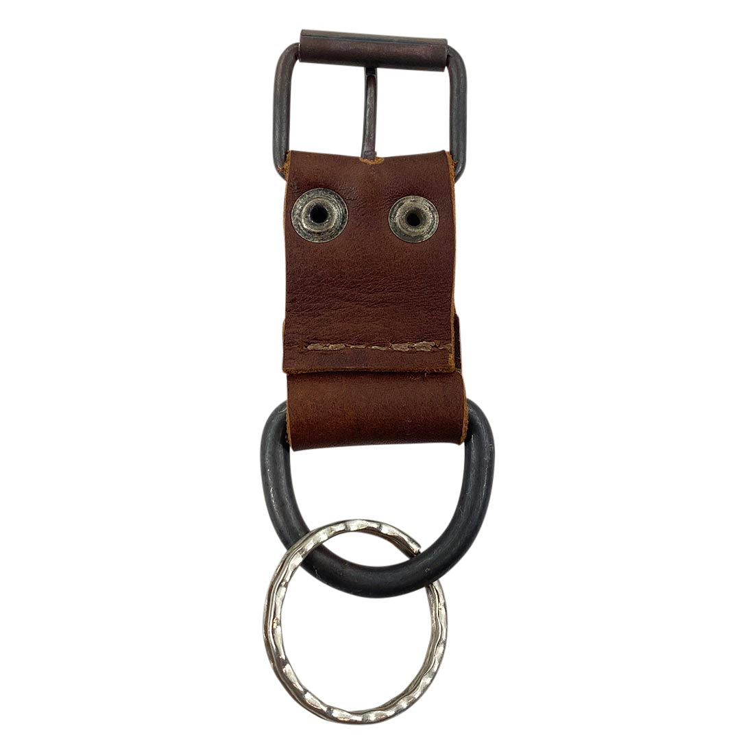 Close-up view of Taco Dog's Dog Collar Keychain made from full grain leather, highlighting its sturdy design and artisan craftsmanship. This functional keychain makes a great gift for dog lovers and features lightweight, all natural materials crafted in La Antigua Guatemala & Oaxaca Mexico.