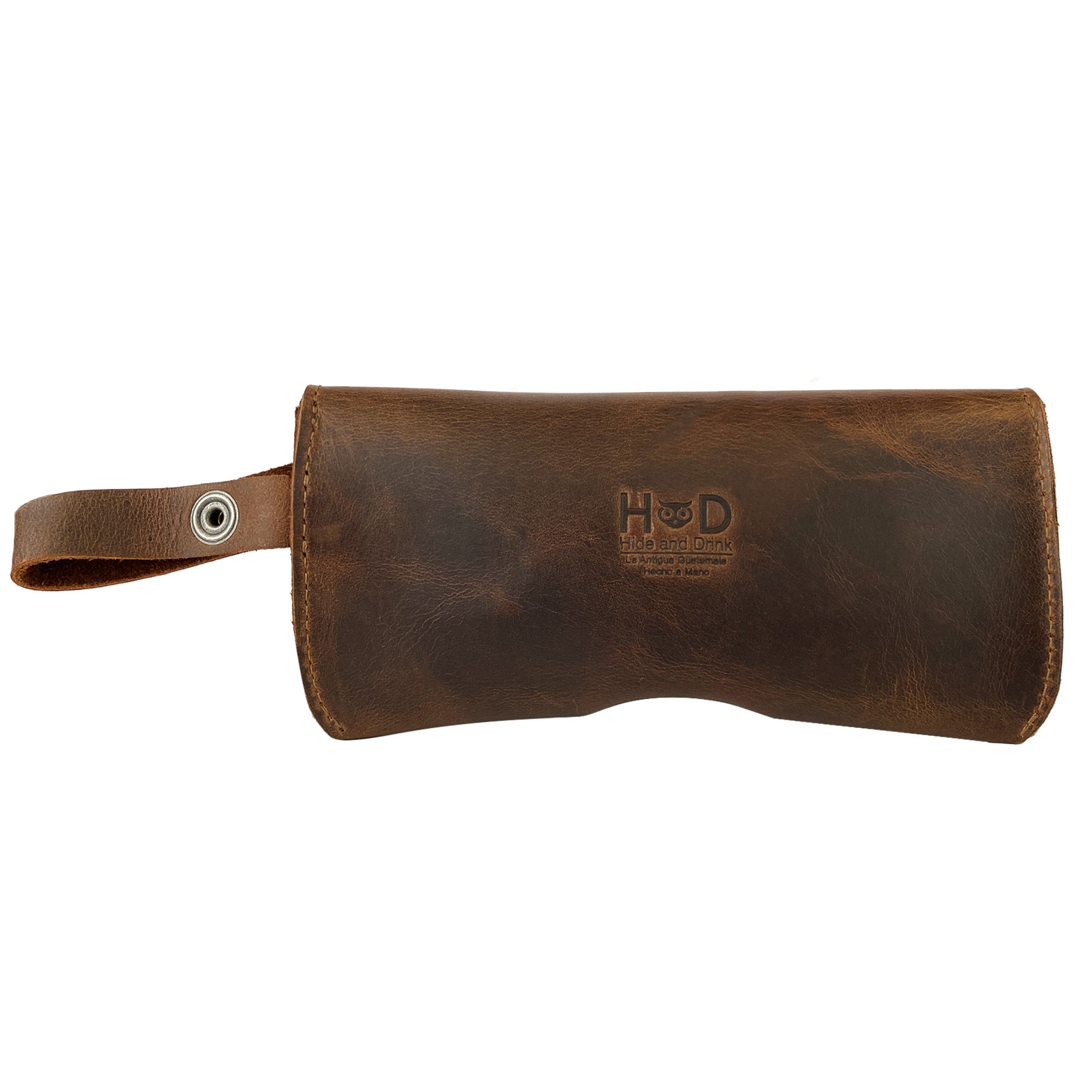 Sleek Eyeglasses Case with Strap from Hide & Drink, crafted from durable full grain leather. This eyewear protector includes a wrist strap, reflecting the artisanal quality of small batch production, hand cut and sewn, made in La Antigua Guatemala & Oaxaca Mexico.