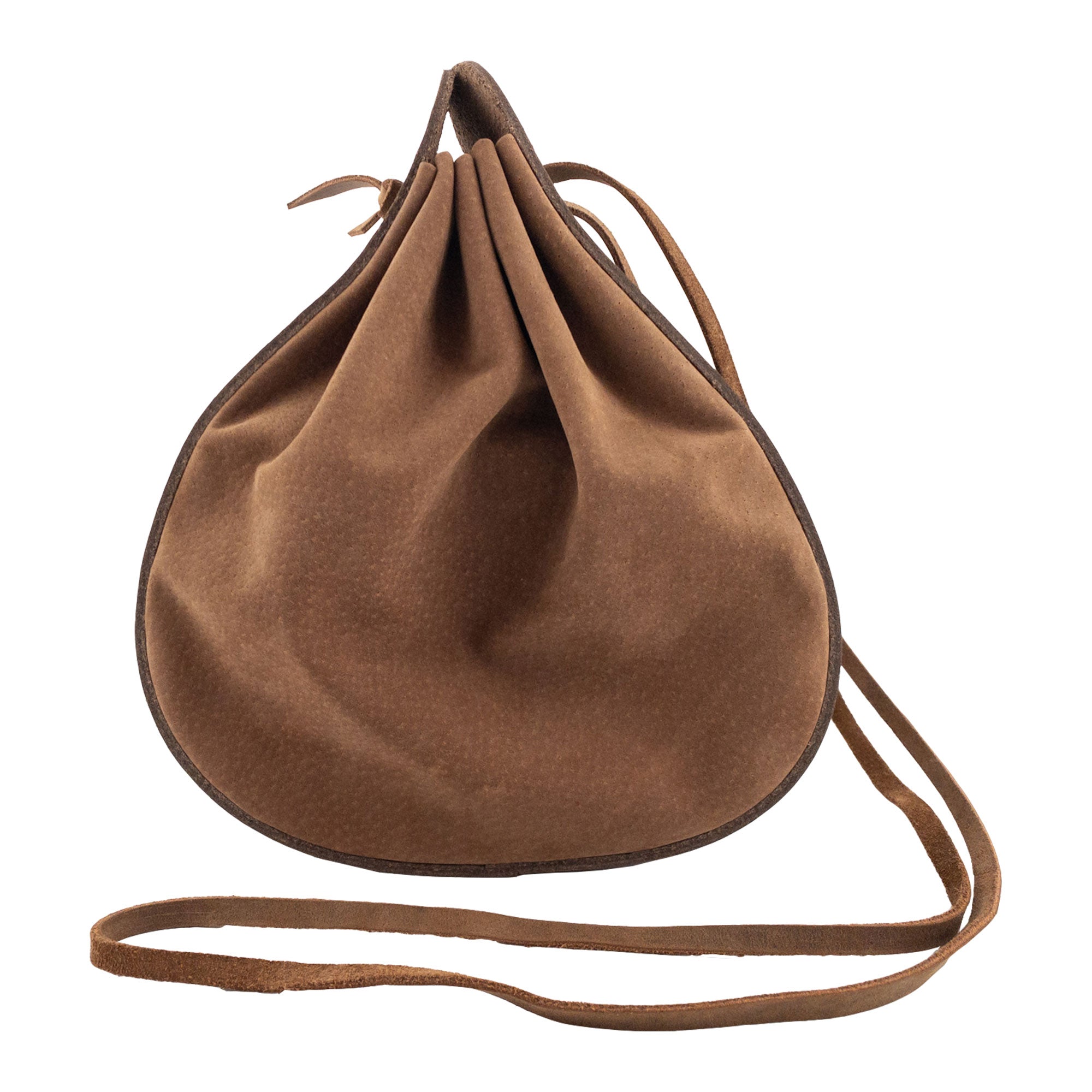 Heather's Shoulder Bag is a multipurpose rounded shoulder bag with a strap, perfect for travel. Made from full grain leather, this artisan product features small batch production, hand cut and hand sewn quality. Fire branded for authenticity, it showcases the craftsmanship of handmade items from La Antigua Guatemala & Oaxaca Mexico.