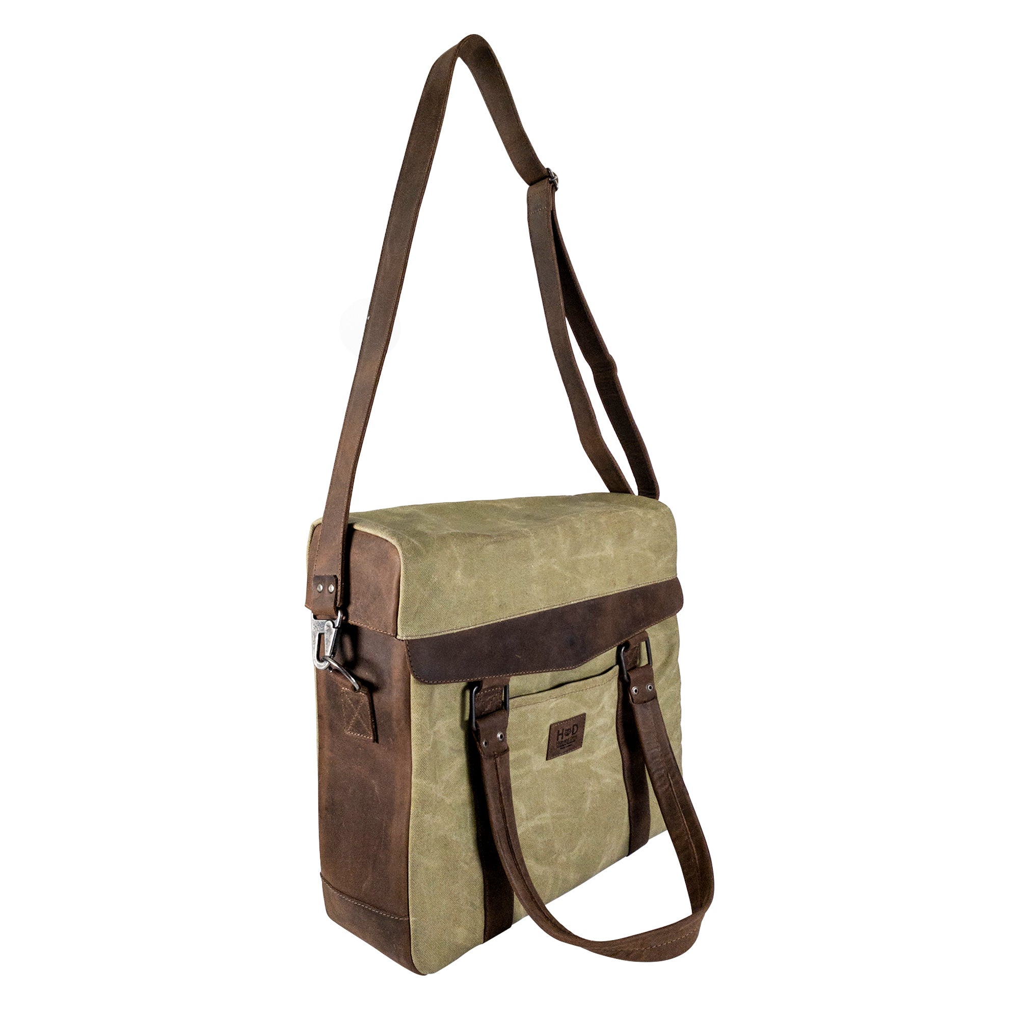 Side view of a Vinyl Records Messenger Bag crafted by Hide & Drink, showcasing the durable design made from high-quality waxed canvas and full grain leather. Ideal for transporting records, this Vinyl Records Messenger Bag is handmade in La Antigua Guatemala & Oaxaca Mexico, combining artisan craftsmanship with modern style.