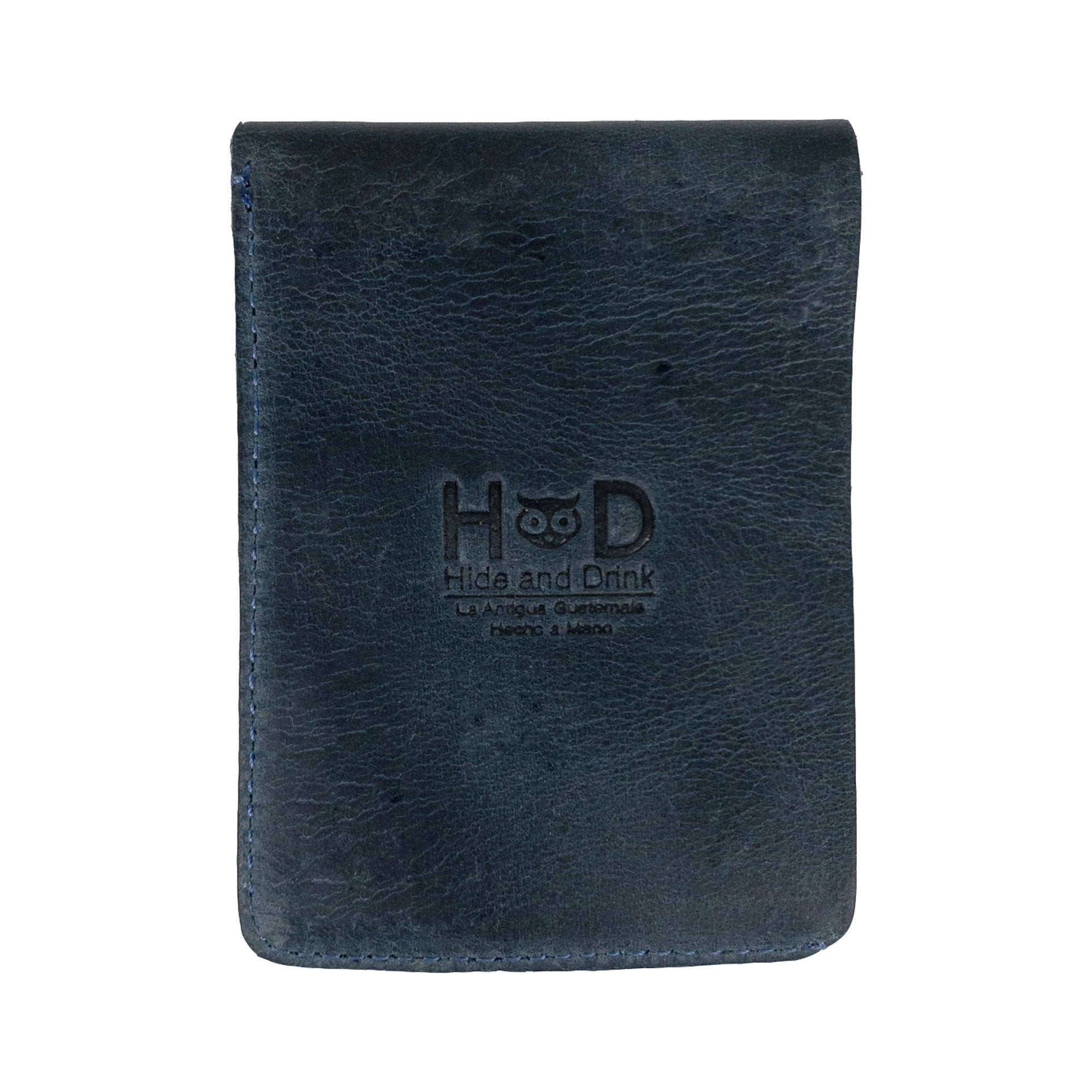 Opened blue Vertical Wallet by Hide & Drink displaying spacious slots for cards and cash. This Vertical Front Pocket Wallet with Card Slot caters to compact storage needs, crafted of full grain leather with small batch production, featuring hand cut and hand sewn craftsmanship, fire branded for authenticity. Handmade in La Antigua Guatemala & Oaxaca Mexico.