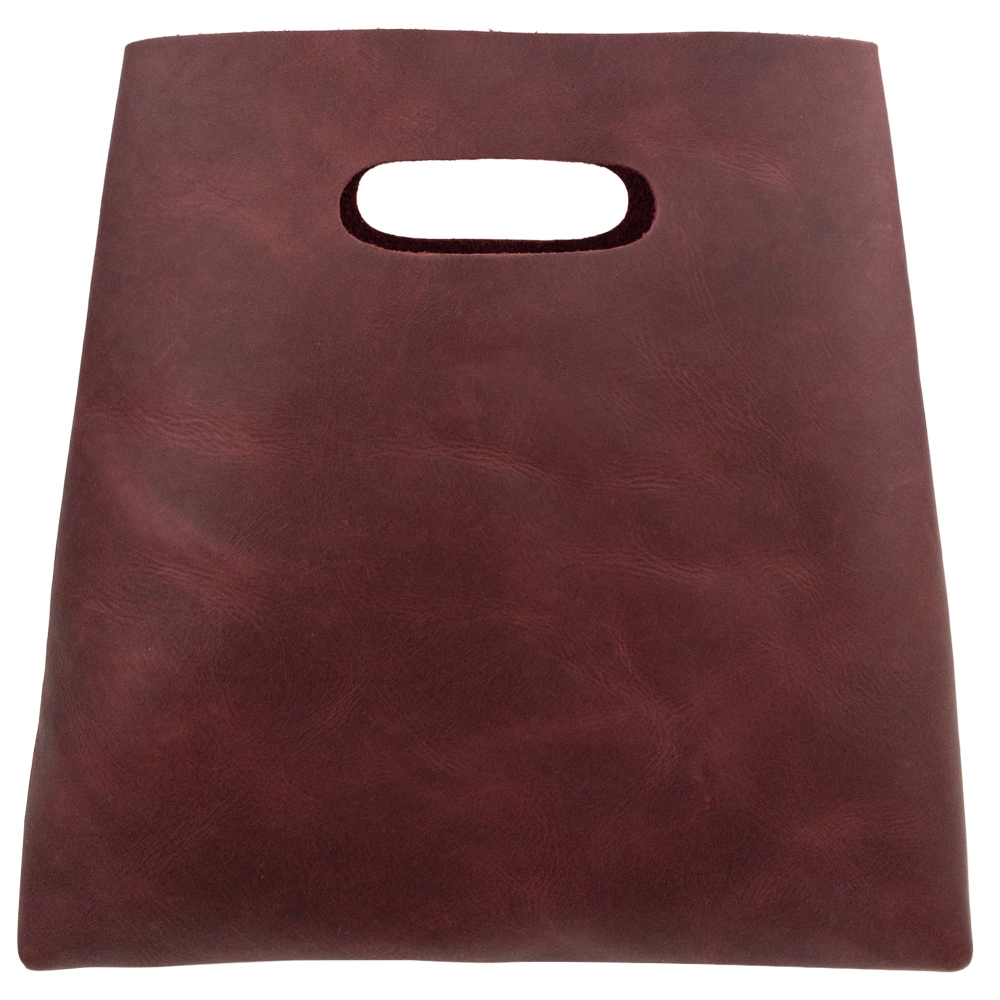 A detailed view of the red Minimalist Boho Handbag from Hide & Drink, emphasizing its rich texture and quality. This Minimalist Handbag for Women makes a stylish Rustic Purse or Shopping Bag, constructed from premium Full Grain Leather, showcasing StockyardX's artisan craftsmanship, created through Hand Cut and Hand Sewn techniques in La Antigua Guatemala & Oaxaca Mexico.