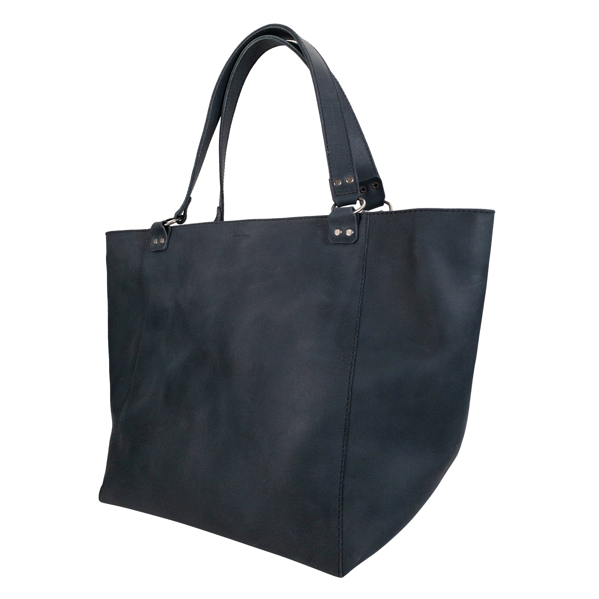 Front view of the Leather Formal Handbag by Hide & Drink, accentuating its elegant Full Grain Leather design. This artisan piece serves as a Female Formal Handbag, Shoulder Bag, or Shopping Bag, ideal for girls. Handmade in La Antigua Guatemala & Oaxaca Mexico.