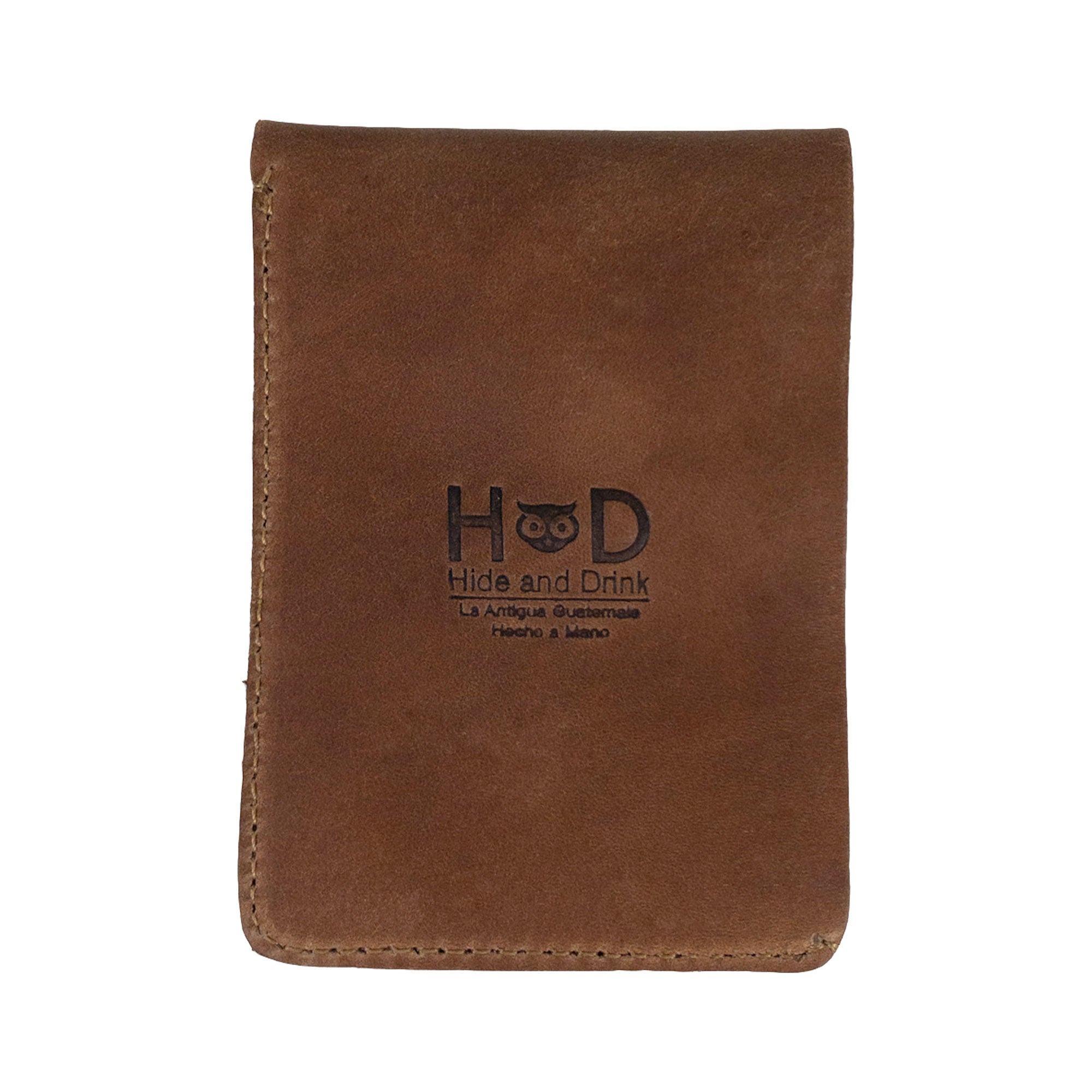 Opened brown Vertical Wallet by Hide & Drink displaying its card and cash compartments. This Vertical Front Pocket Wallet with Card Slot emphasizes compact storage while accommodating cash and cards, made from durable full grain leather, featuring small batch production, hand cut and hand sewn aspects with fire branding for authenticity. Handmade in La Antigua Guatemala & Oaxaca Mexico.