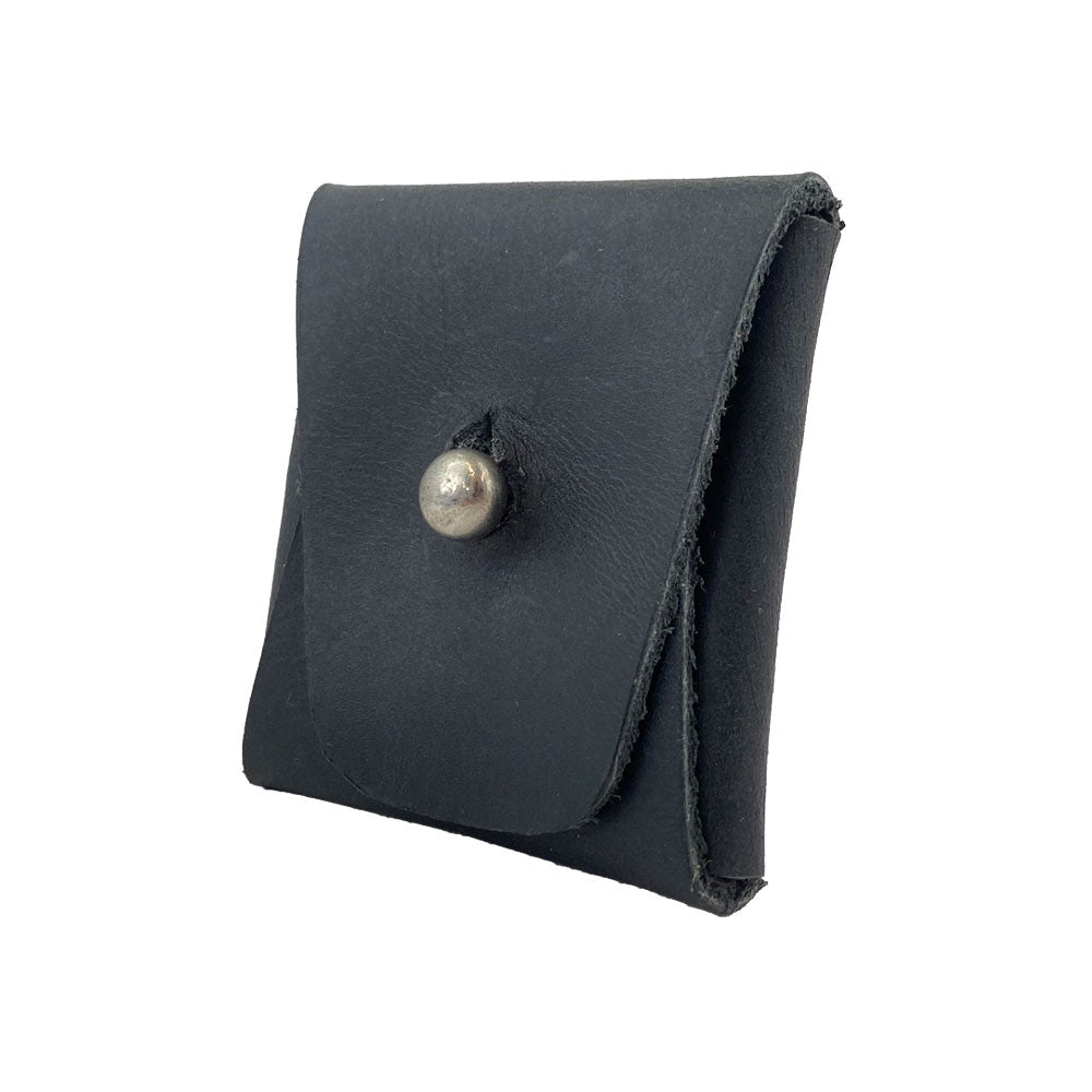 Side view of a navy Minimalist Square Coin Pouch by Hide & Drink, showing its sleek silhouette and functional snap design. Handcrafted from full grain leather, this pouch seamlessly blends style and utility for everyday use. Minimalist Coin Pouch, SD Card Holder, Wallet and Cash Organizer, Full Grain Leather, StockyardX, Small Batch Production, Hand Cut, Hand Sewn, Fire Branded, Artisan, Handmade in La Antigua Guatemala & Oaxaca Mexico.