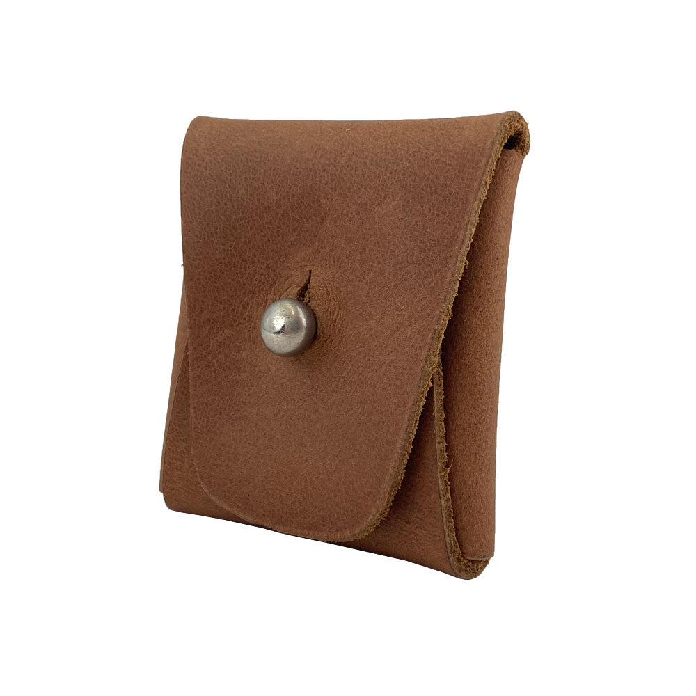 Side angle of a light brown Minimalist Square Coin Pouch by Hide & Drink, demonstrating its elegant snap design. Handcrafted from full grain leather, it combines utility with a sophisticated look perfect for daily use. Minimalist Coin Pouch, SD Card Holder, Wallet and Cash Organizer, Full Grain Leather, StockyardX, Small Batch Production, Hand Cut, Hand Sewn, Fire Branded, Artisan, Handmade in La Antigua Guatemala & Oaxaca Mexico.