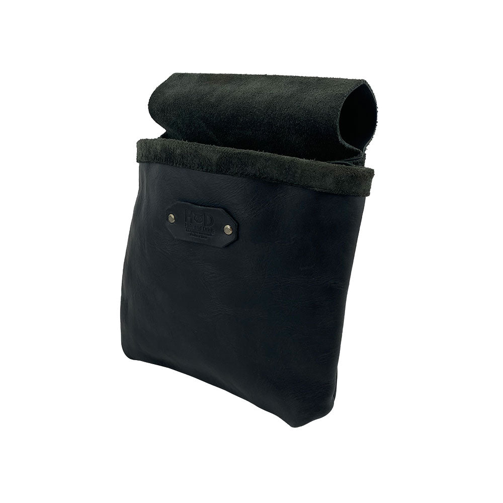 Side view of the Constructor Belt Bag in black by Hide & Drink, essential for constructors. This durable tool bag includes a single big pocket made from high-quality full grain leather and is handcrafted in La Antigua Guatemala & Oaxaca Mexico.