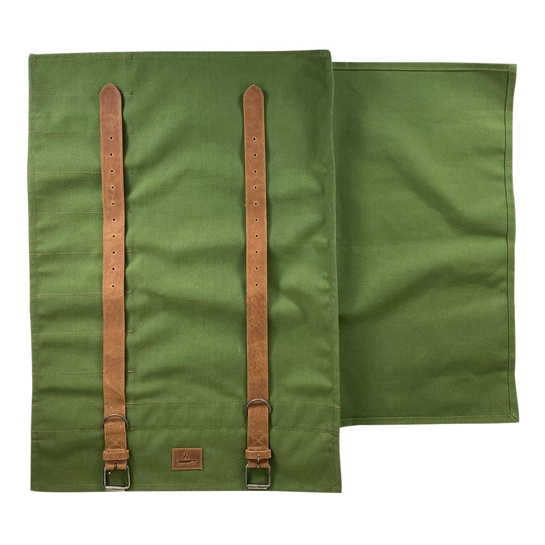 Back view of Cast Leather Co. Knife Roll Bag, highlighting the durable construction with straps. This knife roll bag offers portable storage for specialty knives, is made of water-resistant canvas and full grain leather, and is crafted by artisans in La Antigua Guatemala & Oaxaca Mexico.