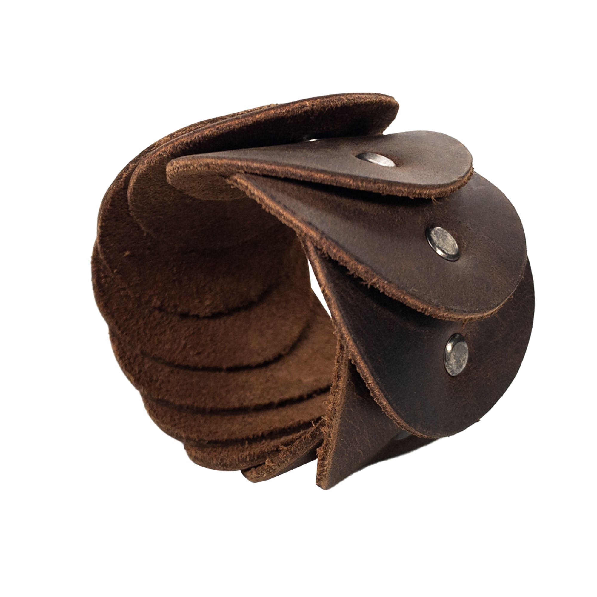 The Moon Bracelet by Heather's showcases a unique, handmade design made from Full Grain Leather. This artisan piece reflects the craftsmanship of Small Batch Production, with each component carefully Hand Cut and Hand Sewn. It's Fire Branded for authenticity, highlighting the artistic tradition from La Antigua Guatemala & Oaxaca Mexico.