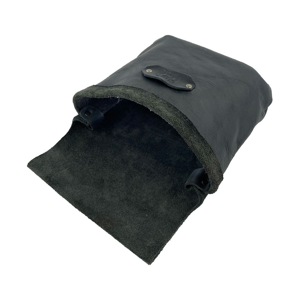 Open view of the Constructor Belt Bag in black by Hide & Drink, designed for constructors. This sturdy tool belt bag features a large main pocket made from full grain leather, artisan-crafted in La Antigua Guatemala & Oaxaca Mexico.