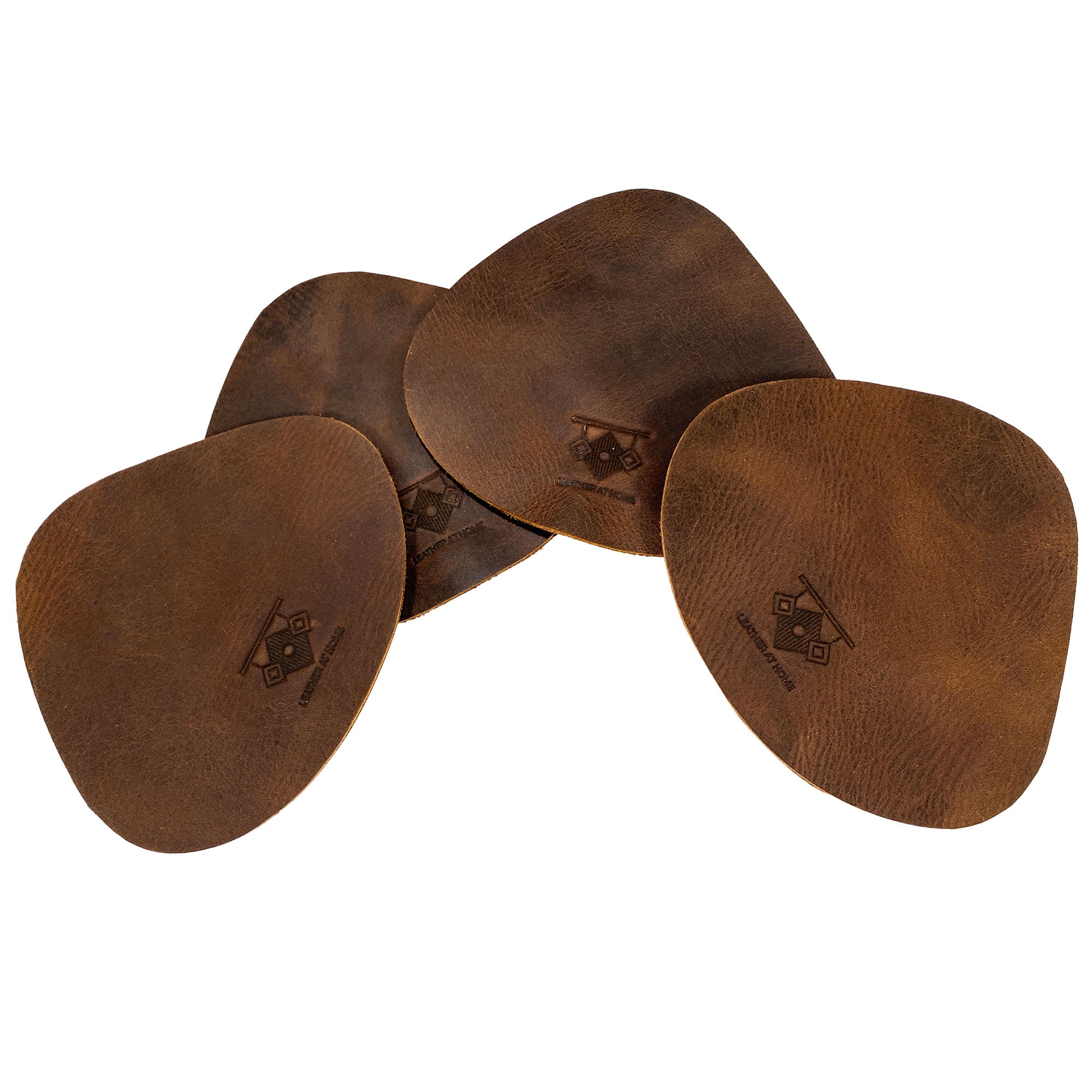 Leather Place Mats with Coasters Set of 4 by Leather At Home captured in a neat stack. Made from durable full grain leather, these rustic placemats and coasters are ideal for adding a touch of art to your dining experience, handcrafted in La Antigua Guatemala & Oaxaca Mexico.