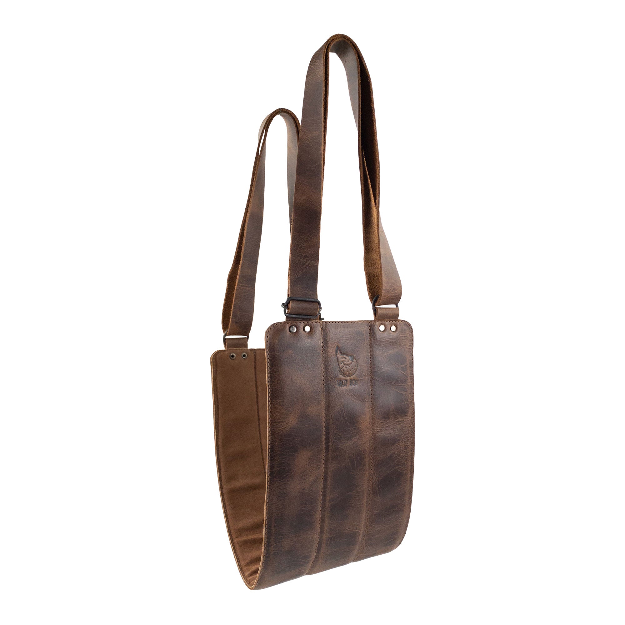 Rustic Dog Lift Harness by Taco Dog made from Full Grain Leather. This handmade recovery sling for rear legs offers support and comfort for pet rehabilitation. Perfect for dogs needing assistance, it features a durable design and is crafted through small batch production, ensuring quality with every piece. Artisan stitched and fire branded, this unique harness is lovingly handmade in La Antigua Guatemala & Oaxaca Mexico.