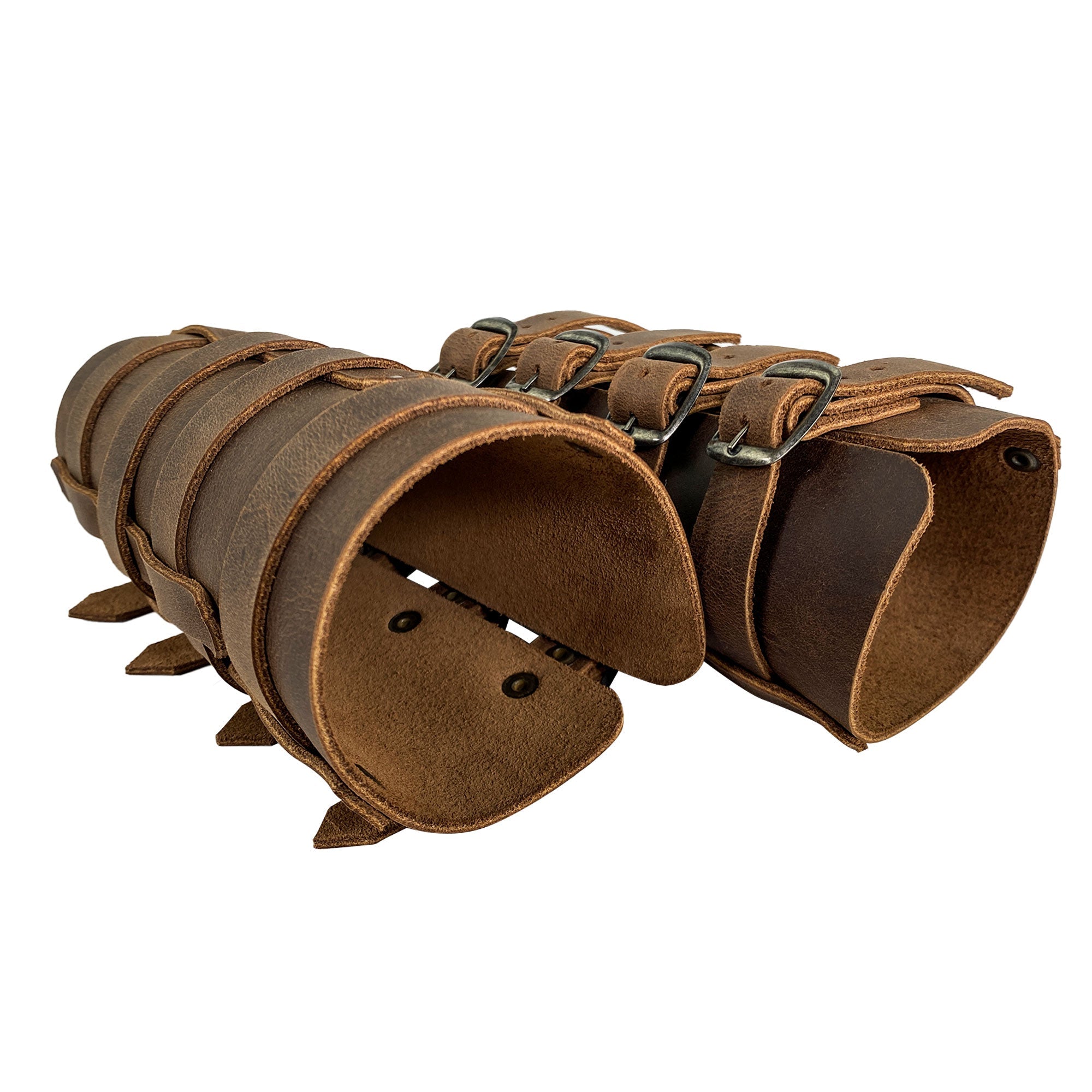 Showcasing the 4 Buckle Bracelet (2 Pack) by Valhalla Gear, this image features a pair of Viking-style bracelets made of full grain leather, designed as hand protectors for archery. The durable and adjustable wrist guards, hand cut and sewn, embody the artisan craftsmanship of StockyardX, made in La Antigua Guatemala & Oaxaca Mexico.