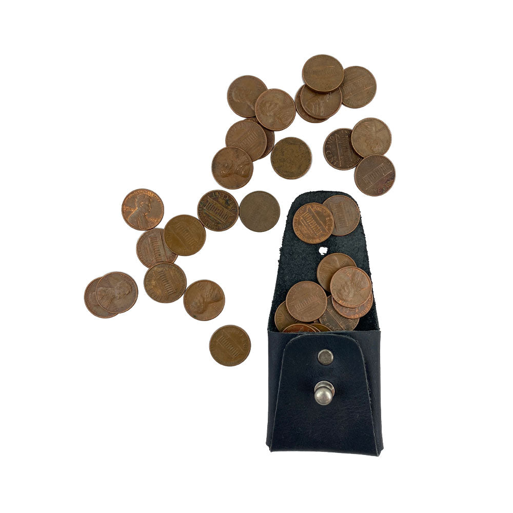 The navy Minimalist Square Coin Pouch by Hide & Drink filled with coins, showcasing its functional design. This artisan-crafted full grain leather pouch is a practical yet elegant option for carrying small items. Minimalist Coin Pouch, SD Card Holder, Wallet and Cash Organizer, Full Grain Leather, StockyardX, Small Batch Production, Hand Cut, Hand Sewn, Fire Branded, Artisan, Handmade in La Antigua Guatemala & Oaxaca Mexico.