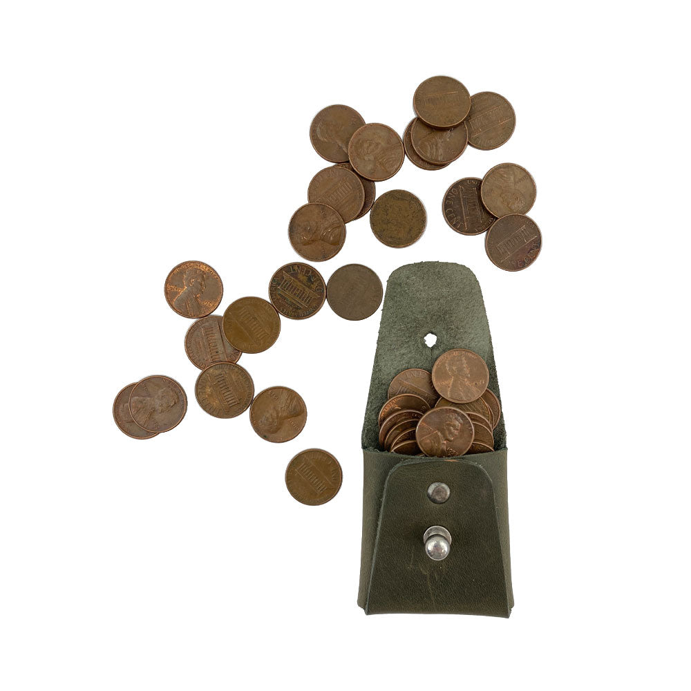 The olive green Minimalist Square Coin Pouch by Hide & Drink filled with coins, emphasizing its practicality and stylish design. This full grain leather pouch combines minimalist elegance with everyday utility. Minimalist Coin Pouch, SD Card Holder, Wallet and Cash Organizer, Full Grain Leather, StockyardX, Small Batch Production, Hand Cut, Hand Sewn, Fire Branded, Artisan, Handmade in La Antigua Guatemala & Oaxaca Mexico.