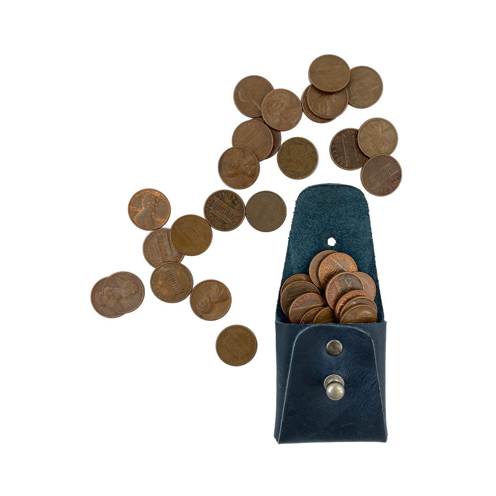 View of a tan Minimalist Square Coin Pouch by Hide & Drink filled with coins, exemplifying its functionality and stylish appeal. This full grain leather pouch blends practicality with chic design, making it an essential accessory. Minimalist Coin Pouch, SD Card Holder, Wallet and Cash Organizer, Full Grain Leather, StockyardX, Small Batch Production, Hand Cut, Hand Sewn, Fire Branded, Artisan, Handmade in La Antigua Guatemala & Oaxaca Mexico.