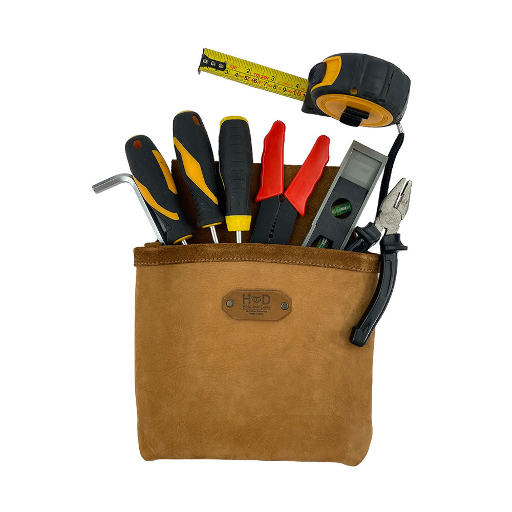 Constructor Belt Bag in tan by Hide & Drink filled with tools, ideal for constructors. This tool bag includes a single big pocket and is artisan-crafted from durable full grain leather in La Antigua Guatemala & Oaxaca Mexico.