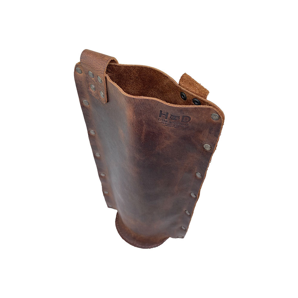 Rustic Wine Carrier For Standard 750ml Bordeaux Bottle by Hide & Drink, focusing on the sturdy design of this Single Wine Carrier crafted from Full Grain Leather. Experience the quality of small batch production, artisanal hand cutting, and sewing, fire branded, made in La Antigua Guatemala & Oaxaca Mexico.