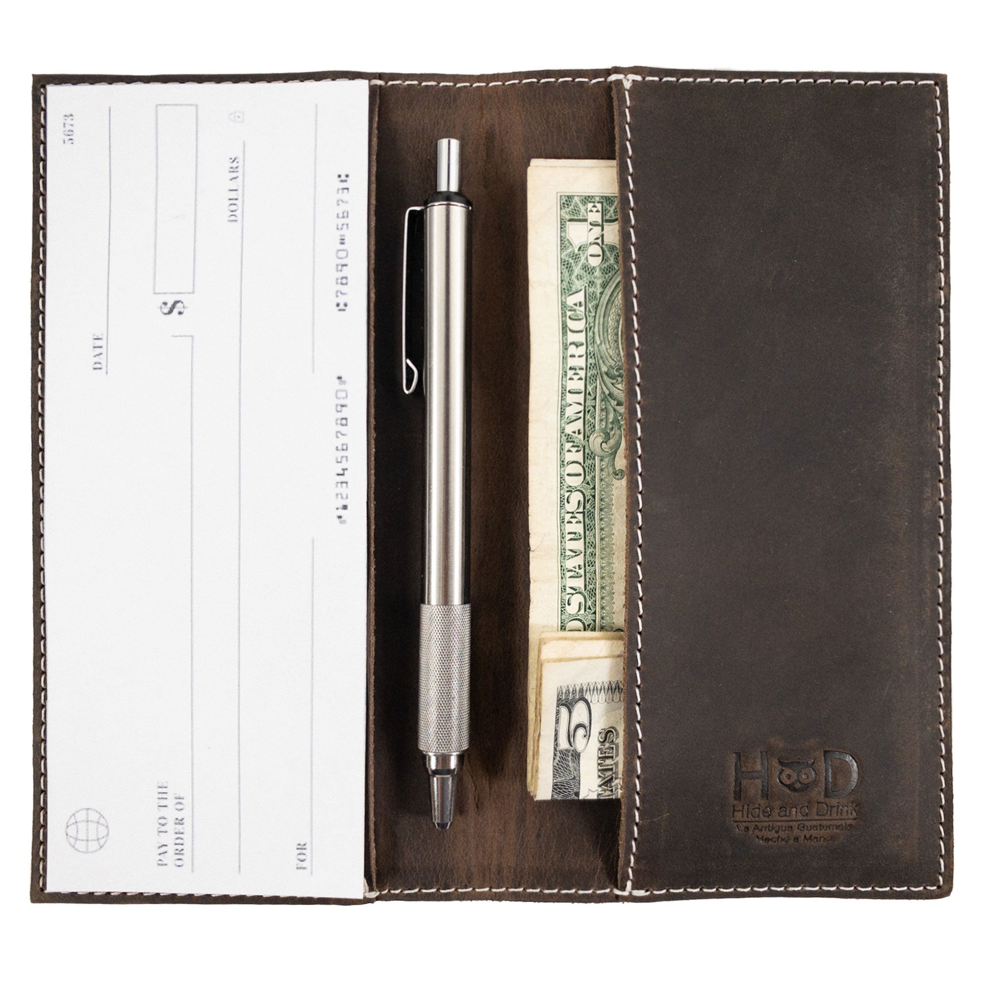 Close-up detailing of the Checkbook Leather Cover by Hide & Drink, emphasizing its purpose as a minimalist organizer for standard checkbooks. This artisan piece, made from full grain leather, is handmade in La Antigua Guatemala and Oaxaca Mexico, showcasing small batch production.