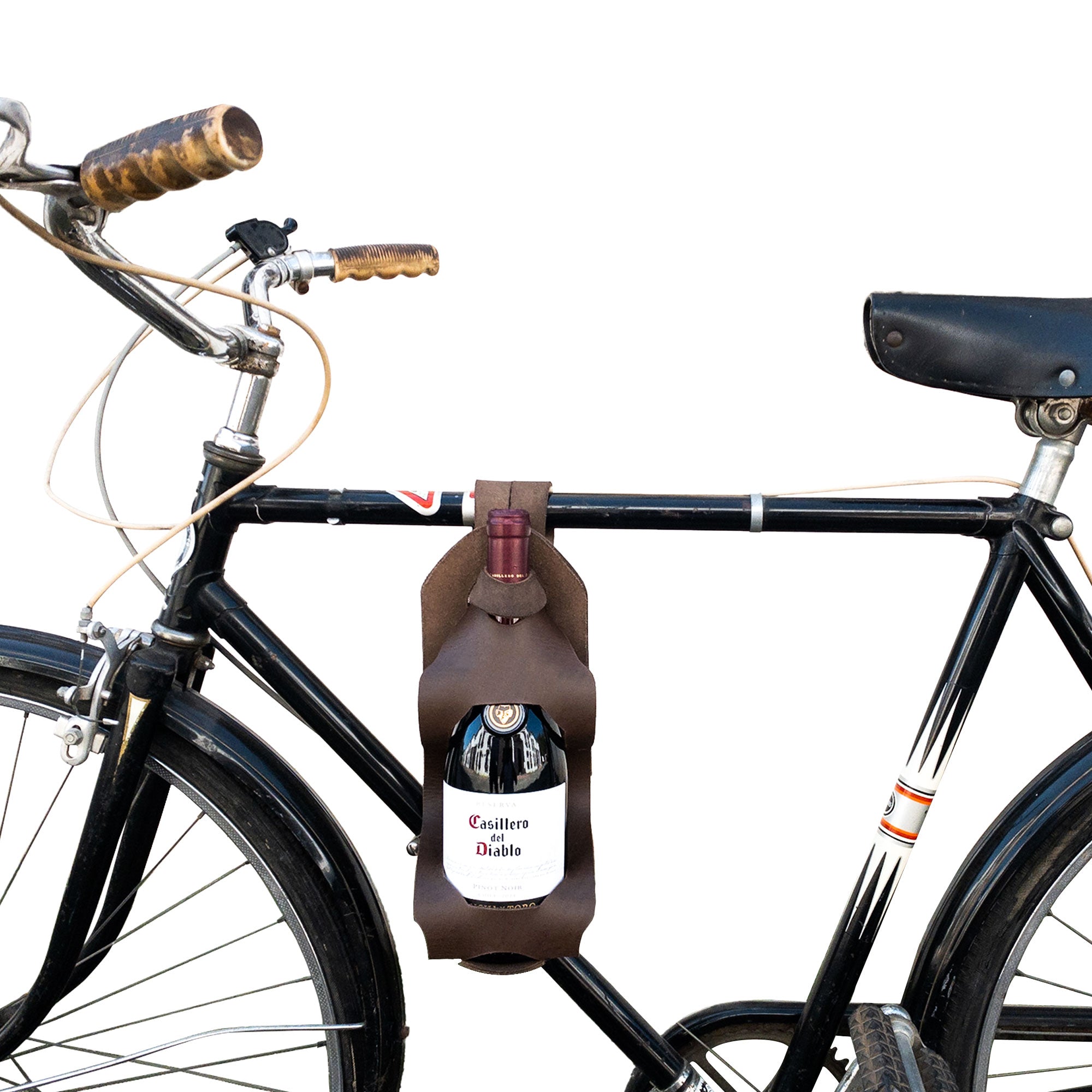 A bicycle showcasing the Unibody Bike Wine Carrier from Hide & Drink, featuring a durable and stylish Full Grain Leather design. StockyardX ensures quality with small batch production and artisan craftsmanship. This handmade wine carrier is perfect for biking adventures.