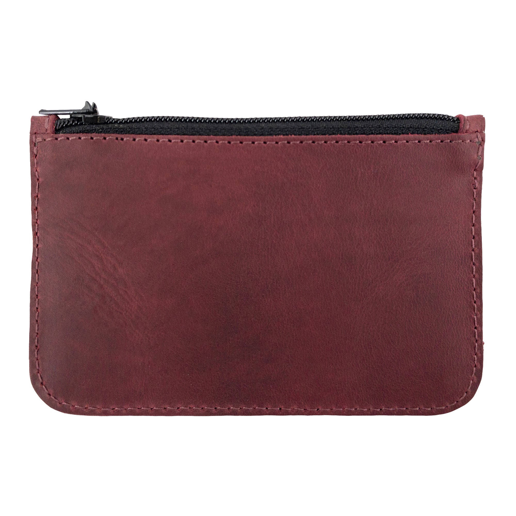 Close-up of the Hide & Drink zippered wallet showcasing the smooth Full Grain Leather surface, perfect for a stylish Card Case, ideal for storing folded bills and coins, handmade in La Antigua Guatemala & Oaxaca Mexico.