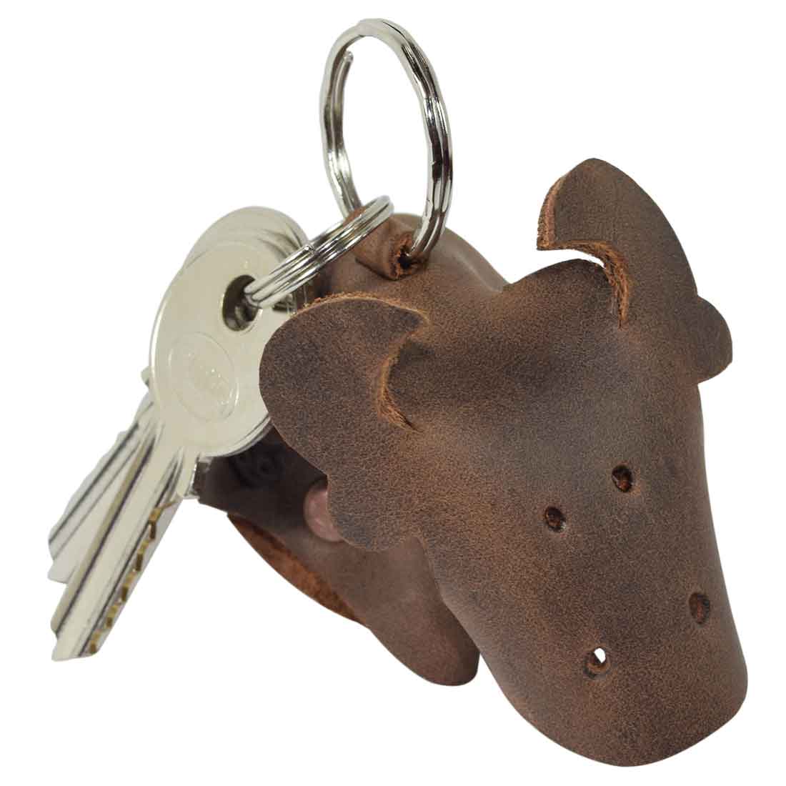 Cute Full Grain Leather Animal Key Chain from Hide & Drink featuring a charming cow design. This Critter Keychain is an adorable fob charm and unique animal key holder charm pendant, showcasing high-quality craftsmanship. Hand cut and sewn in La Antigua Guatemala, it represents small batch production with artisan detailing.