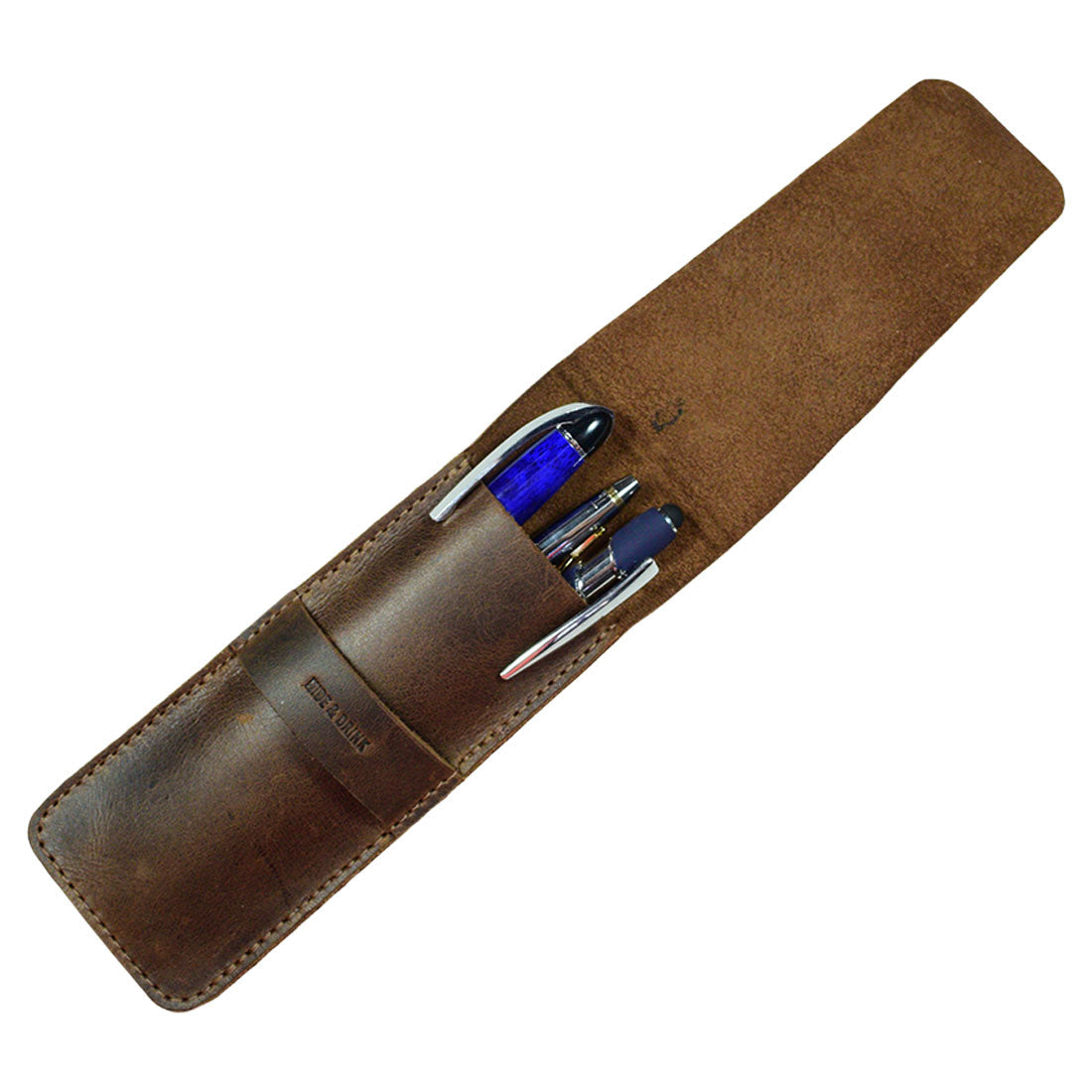 An open view of the Hide & Drink Pen Case revealing its spacious interior, perfect for organizing your writing instruments. This rustic Pen Case Holder serves as a Multi Pen Pouch, embodying the essence of office essentials. Crafted from high-quality Full Grain Leather through small batch production, each piece is hand cut and hand sewn. The fire branded logo highlights its artisan quality, showcasing fine craftsmanship from La Antigua Guatemala & Oaxaca Mexico.