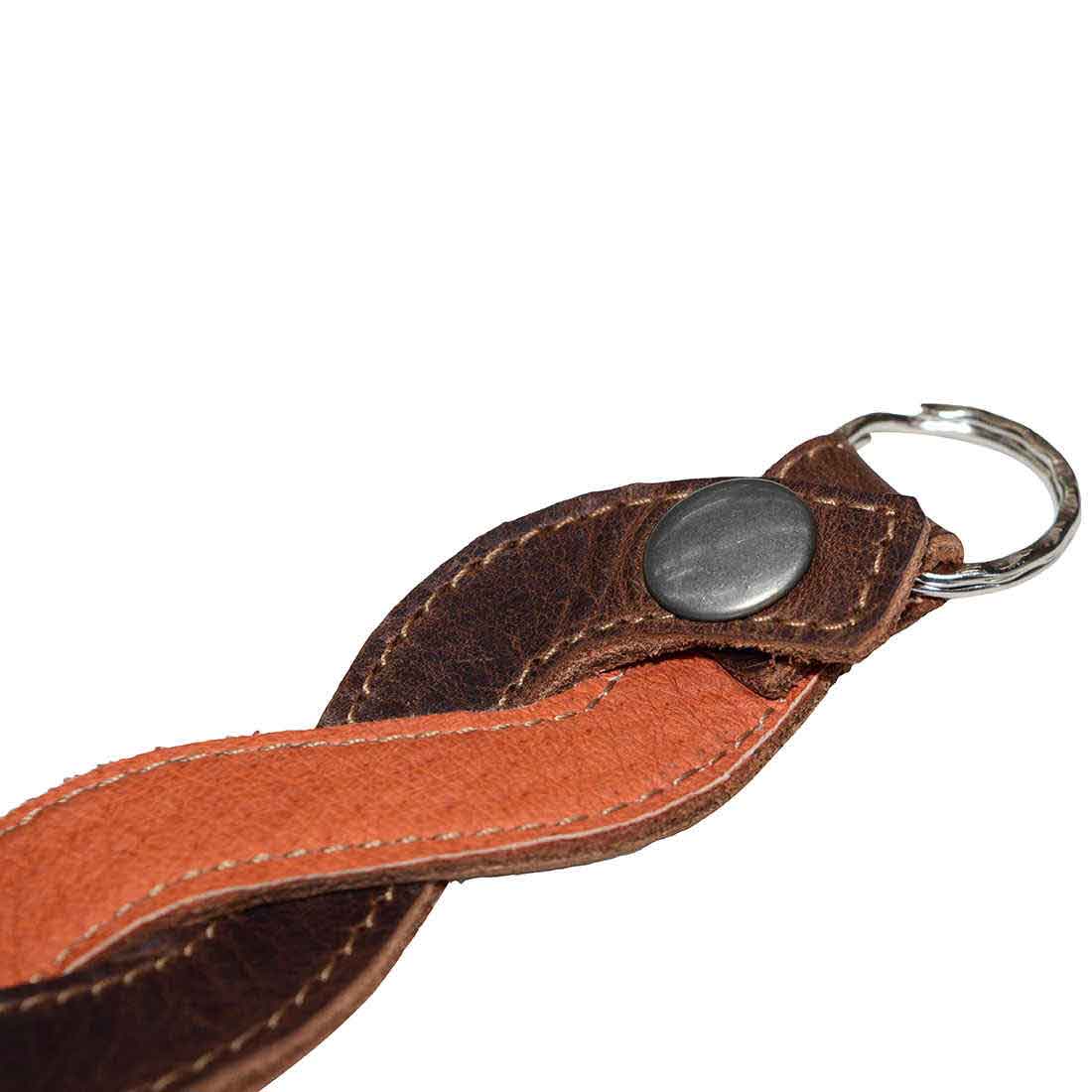 Detailed view of the button fastener on a Braided Keychain by Hide & Drink, emphasizing high-quality full grain leather, ideal for stylish key holders and vintage accessories.