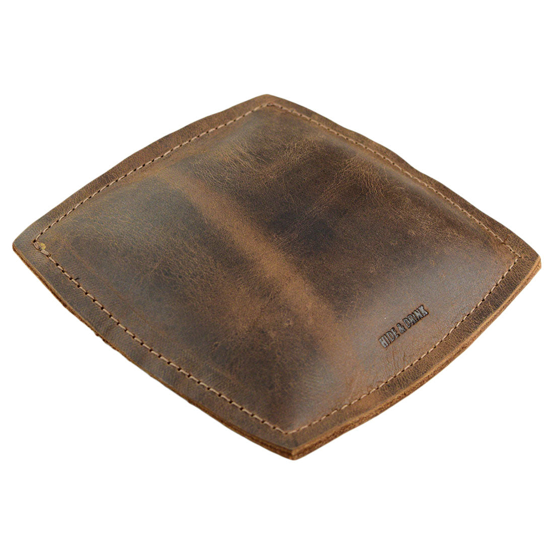 Forearm Cushion by Hide & Drink, a handcrafted full grain leather wrist rest pad designed for computer accessories, providing excellent mouse support. This small batch production item is hand cut, hand sewn, and fire branded, showcasing artisan work made in La Antigua Guatemala & Oaxaca Mexico.